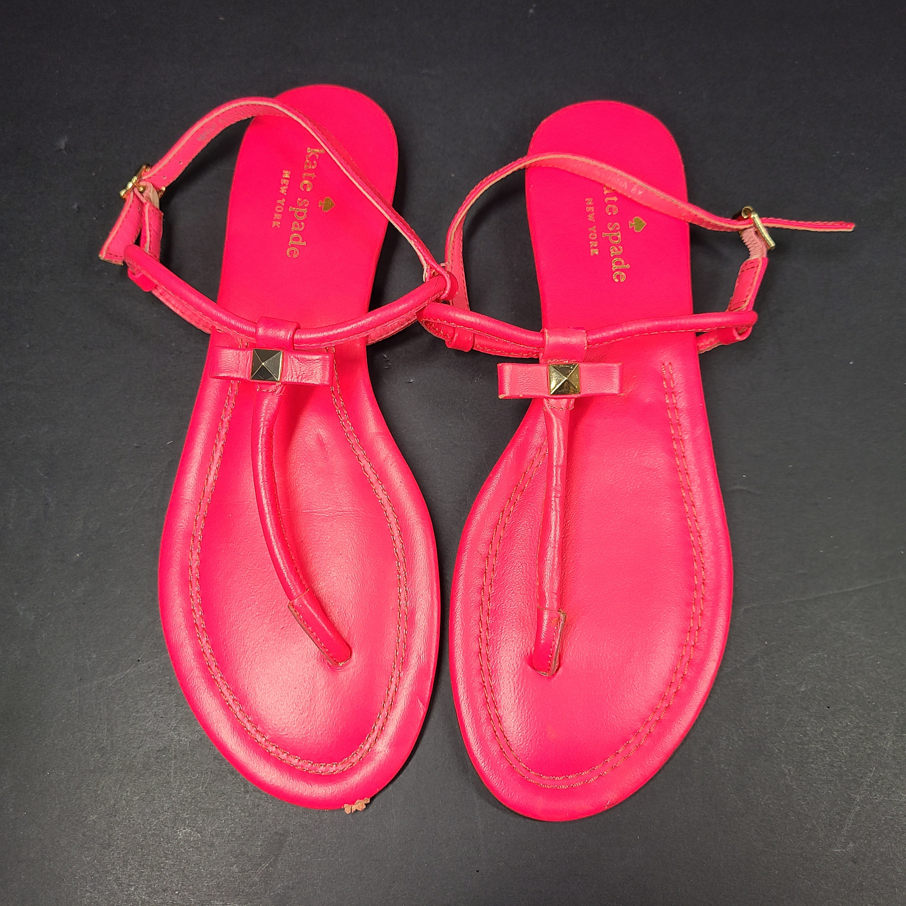 A pair of pink Kate Spade New York sandals