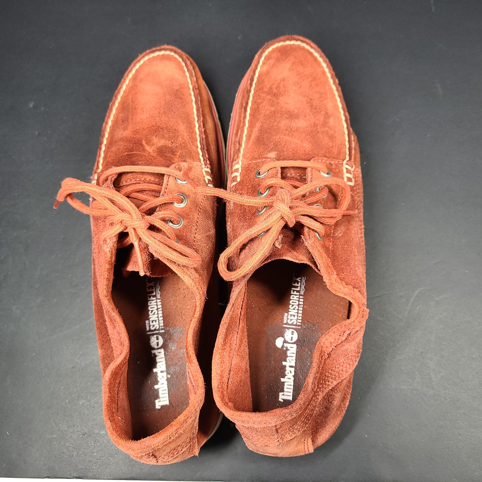 A pair of men's Timberland SensorFlex suede shoes in a rustic color
