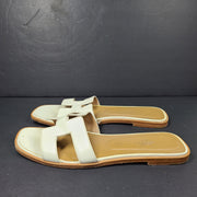 A pair of white leather Hermès Oran sandals with size 41 embossed in Italy