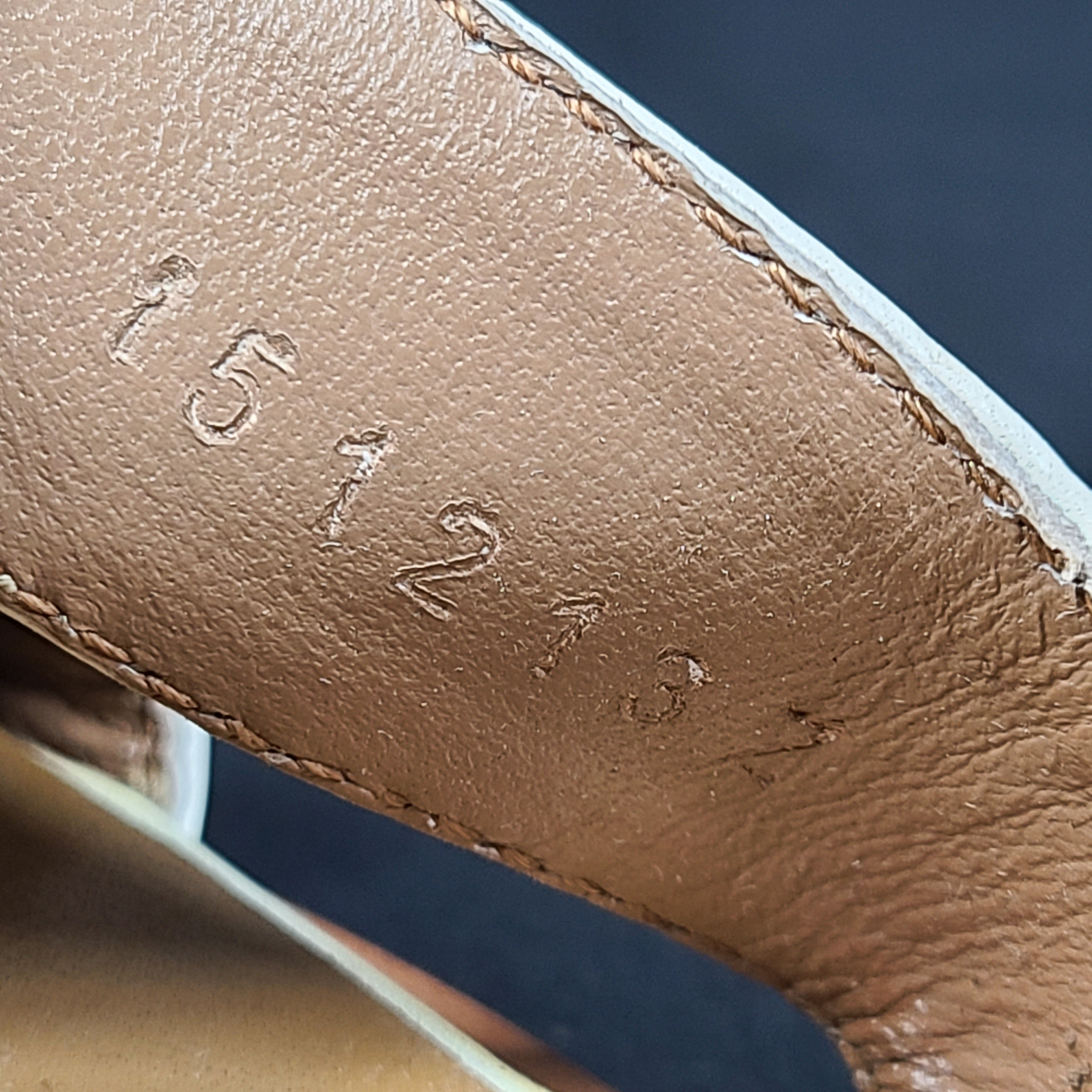 A pair of white leather Hermès Oran sandals with size 41 embossed in Italy