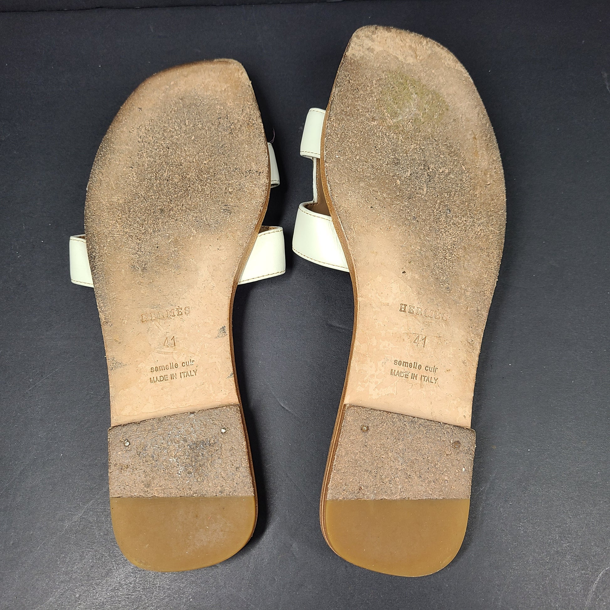 A pair of white leather Hermès Oran sandals with size 41 embossed in Italy