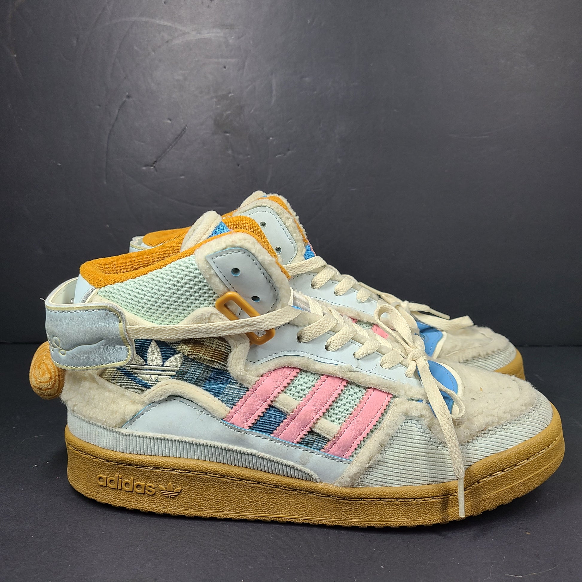 A pair of multicolor Adidas sneakers with artistic design