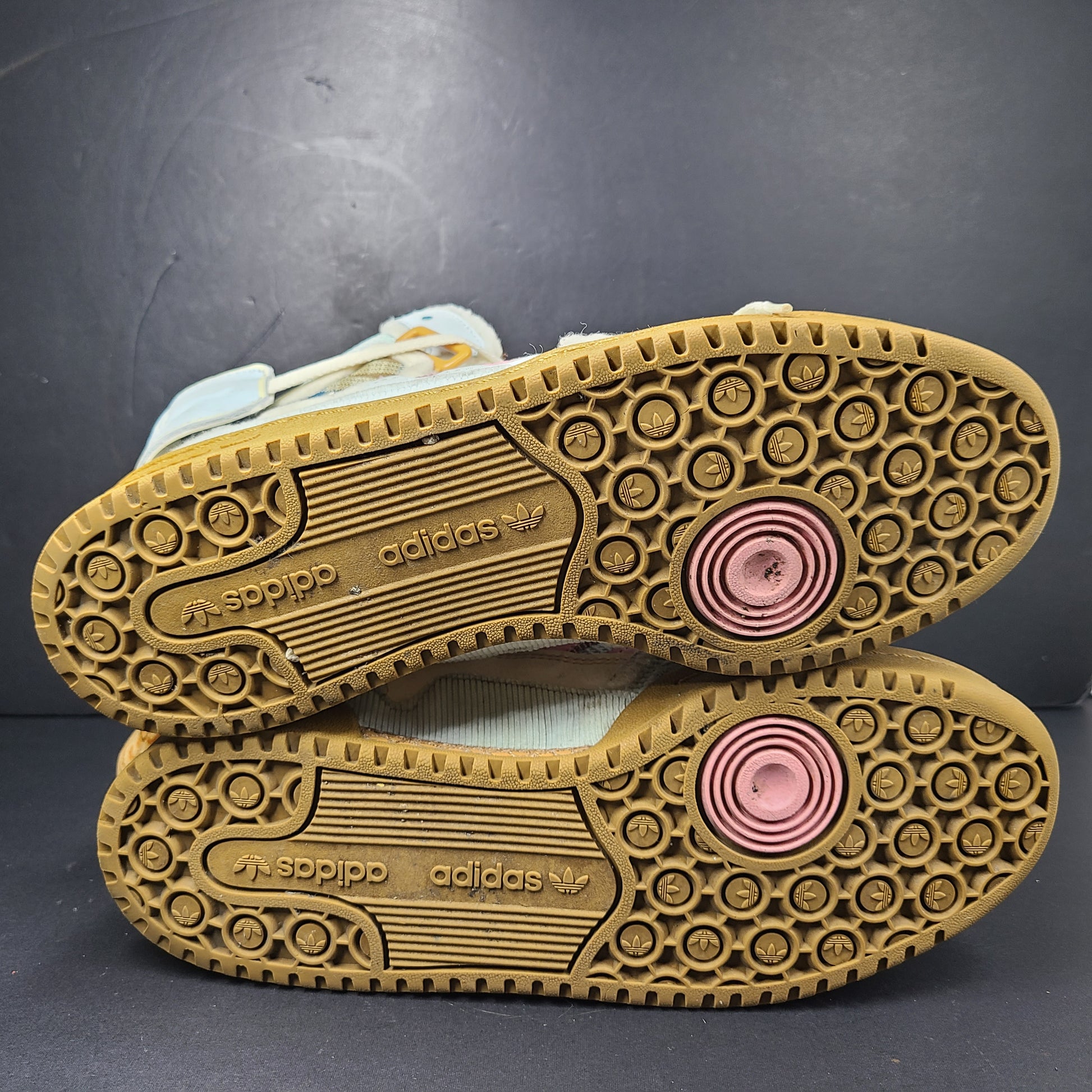A pair of multicolor Adidas sneakers with artistic design