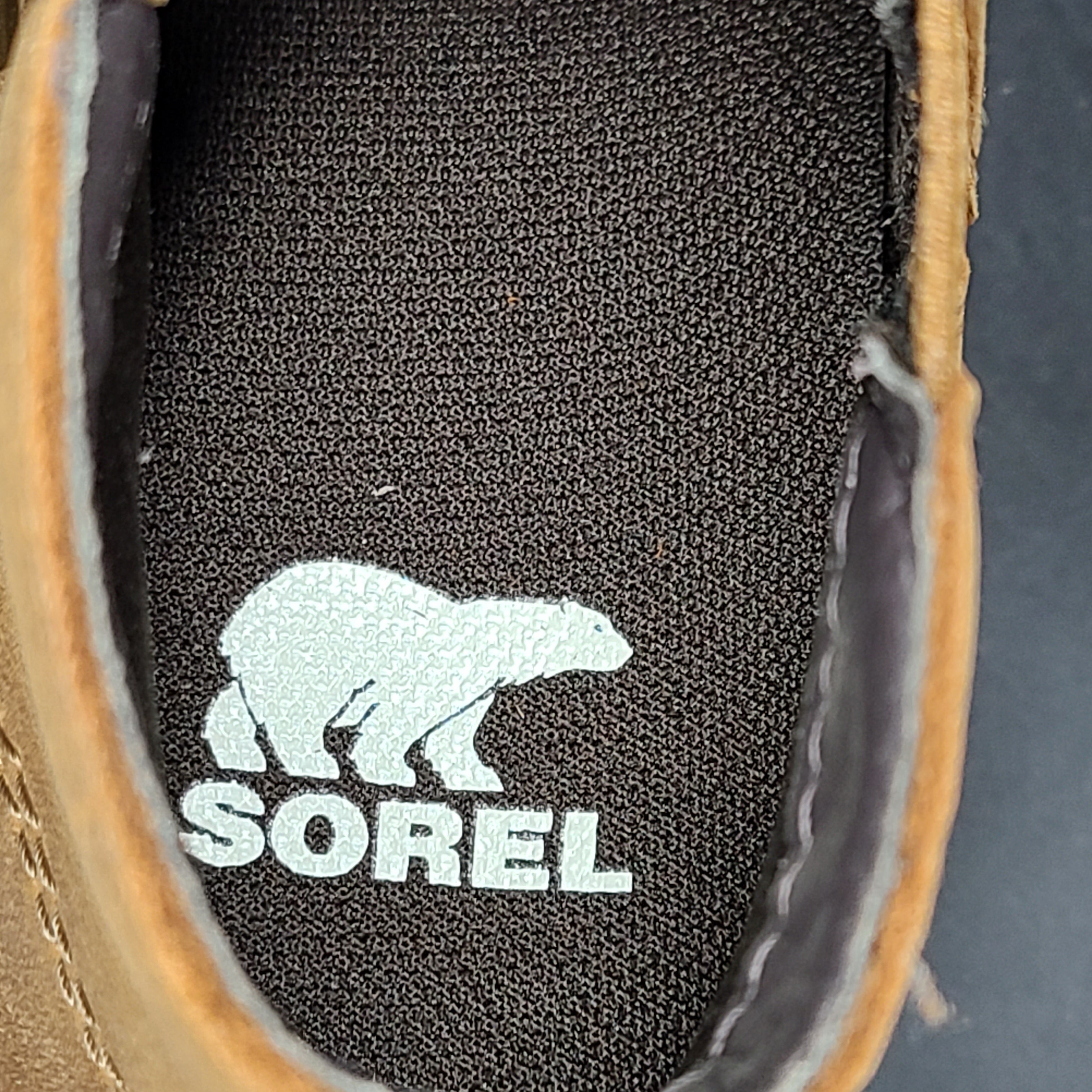 A pair of tan Sorel Chelsea boots for women in size 7.5