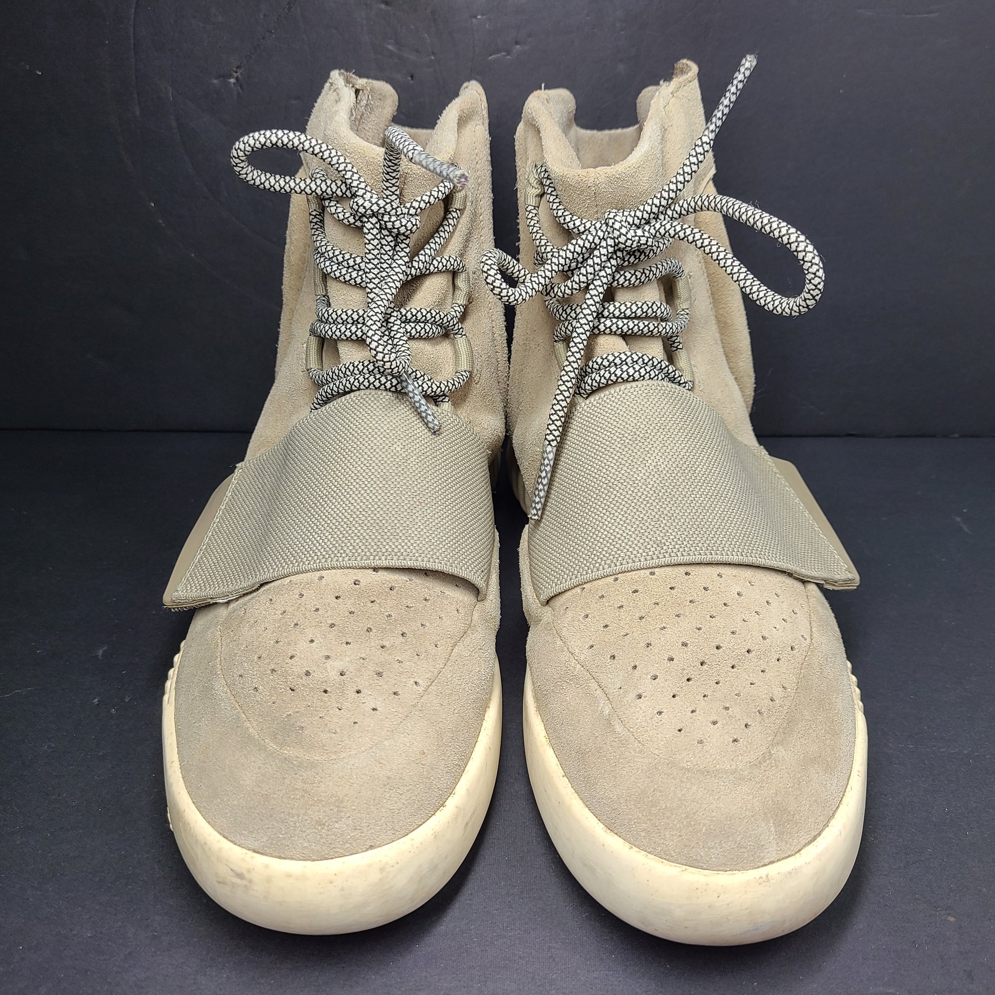 A pair of men's Adidas Yeezy Boost 750 Light Brown sneakers in size 11.