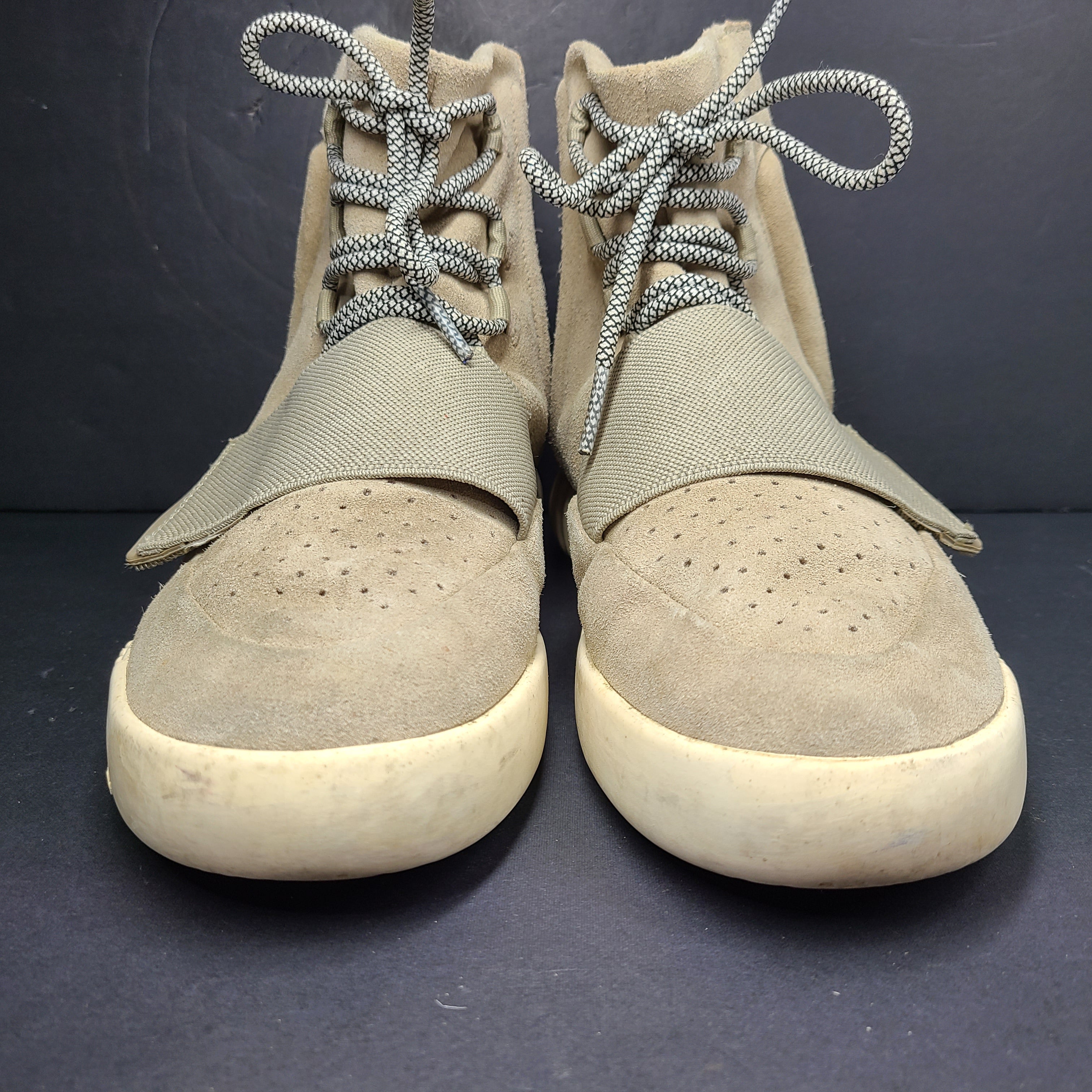 A pair of men's Adidas Yeezy Boost 750 Light Brown sneakers in size 11.