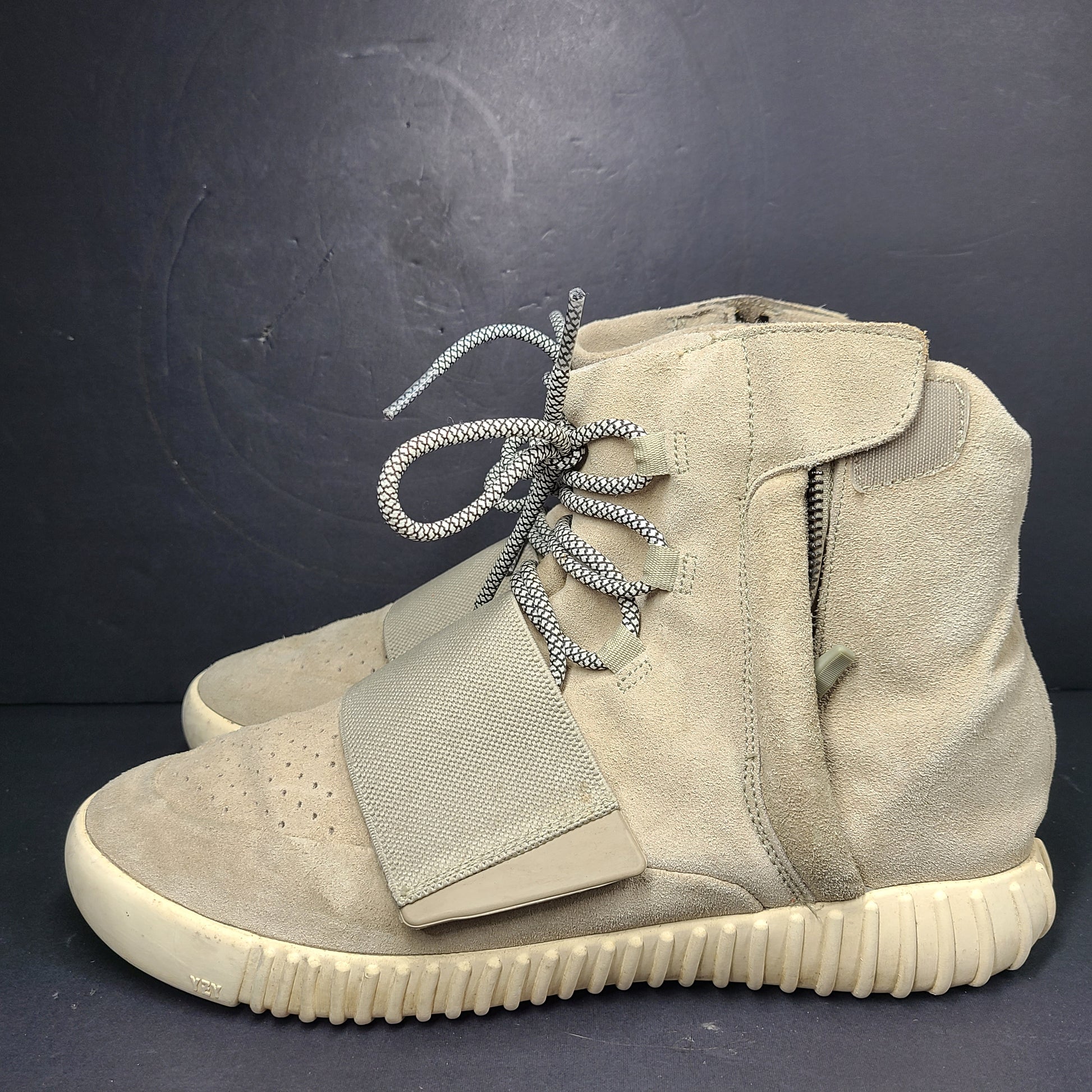 A pair of men's Adidas Yeezy Boost 750 Light Brown sneakers in size 11.