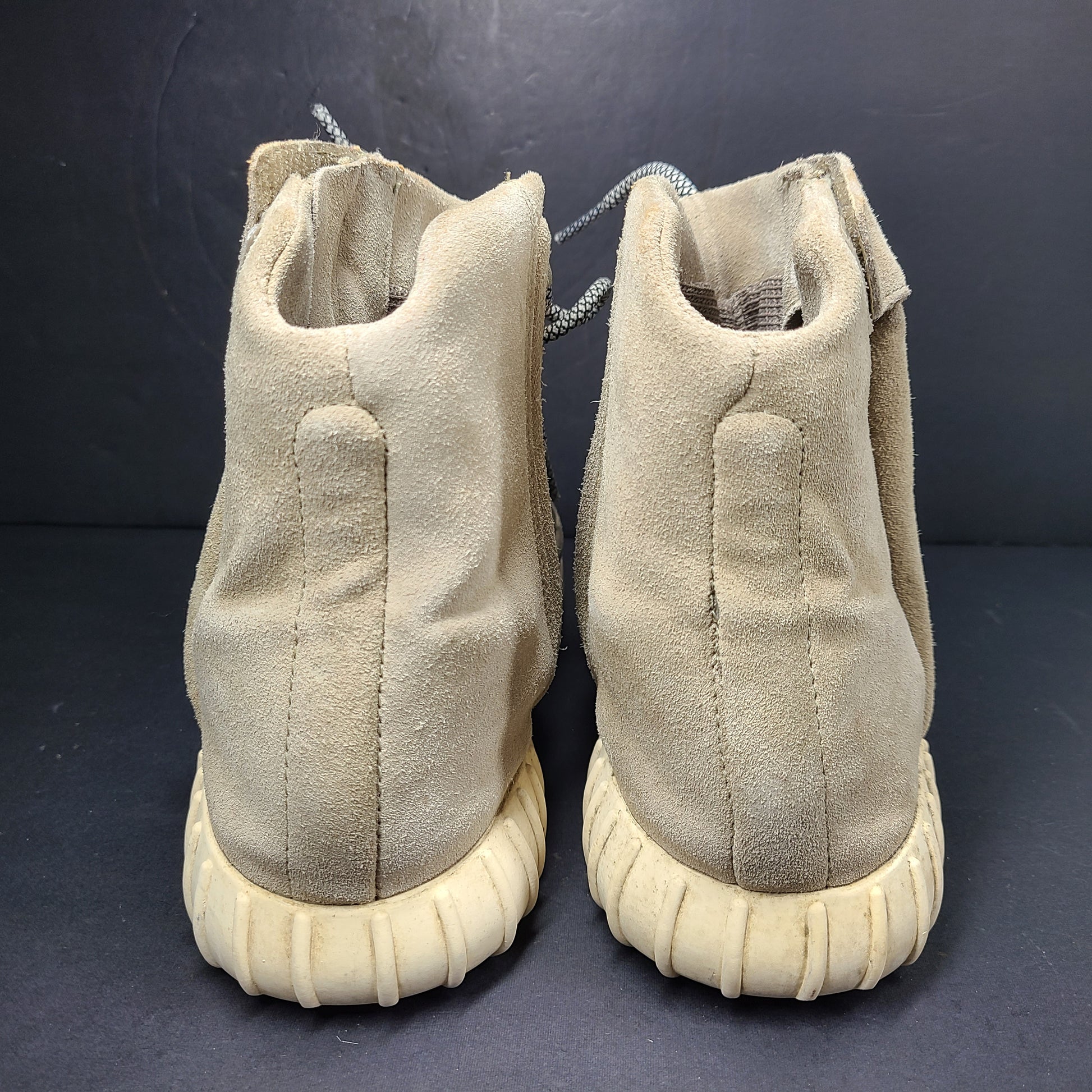 A pair of men's Adidas Yeezy Boost 750 Light Brown sneakers in size 11.
