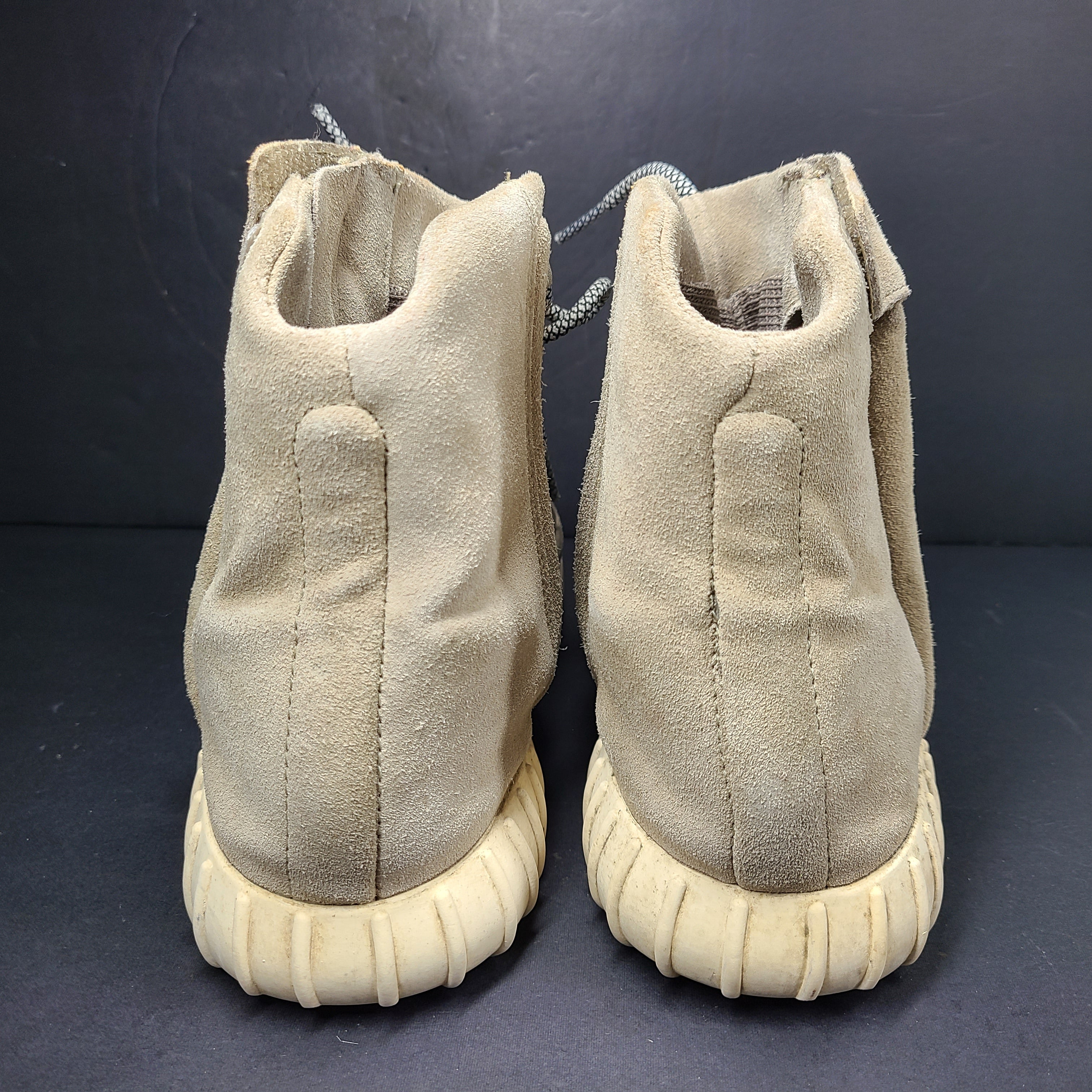A pair of men's Adidas Yeezy Boost 750 Light Brown sneakers in size 11.