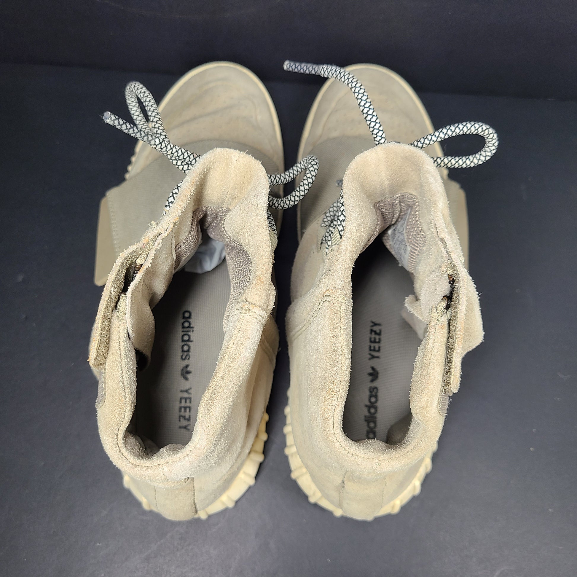 A pair of men's Adidas Yeezy Boost 750 Light Brown sneakers in size 11.