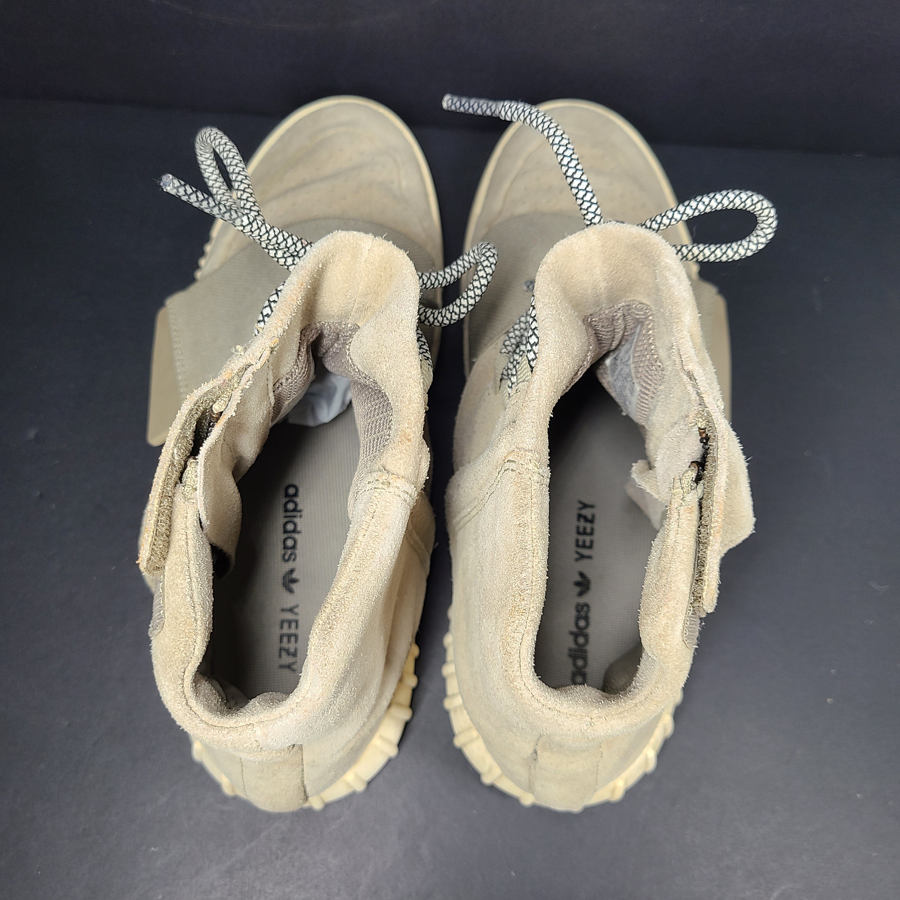 A pair of men's Adidas Yeezy Boost 750 Light Brown sneakers in size 11.