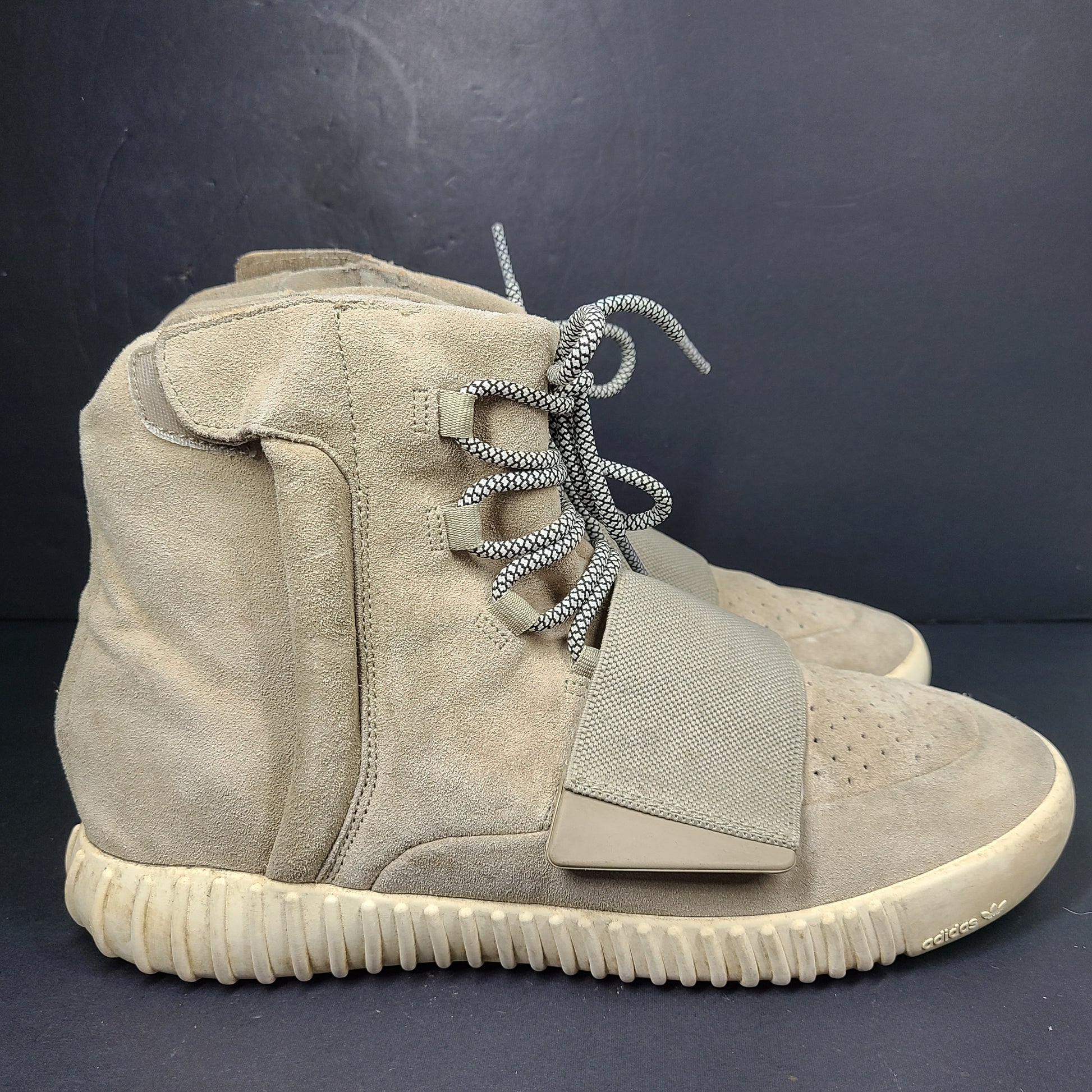 A pair of men's Adidas Yeezy Boost 750 Light Brown sneakers in size 11.