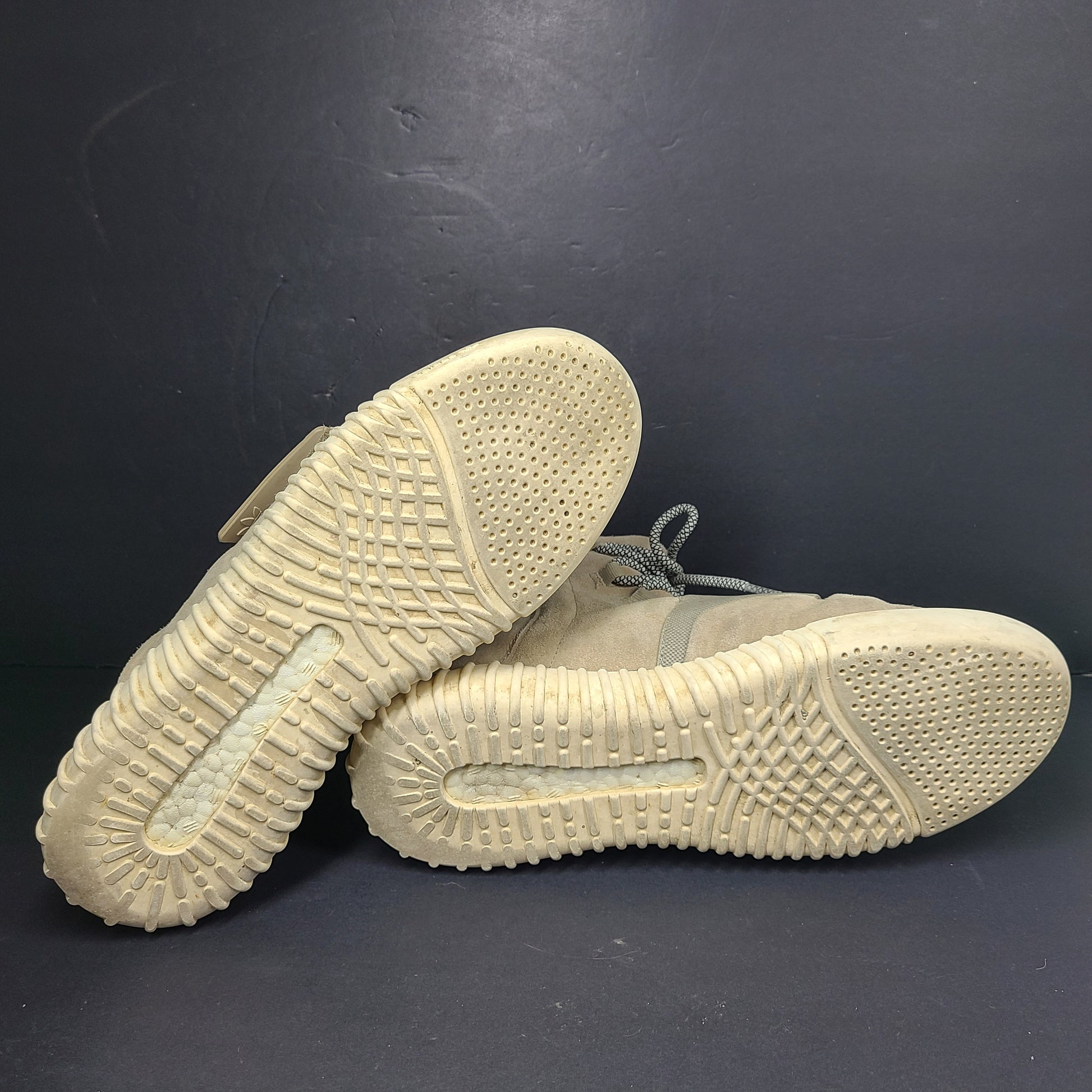 A pair of men's Adidas Yeezy Boost 750 Light Brown sneakers in size 11.