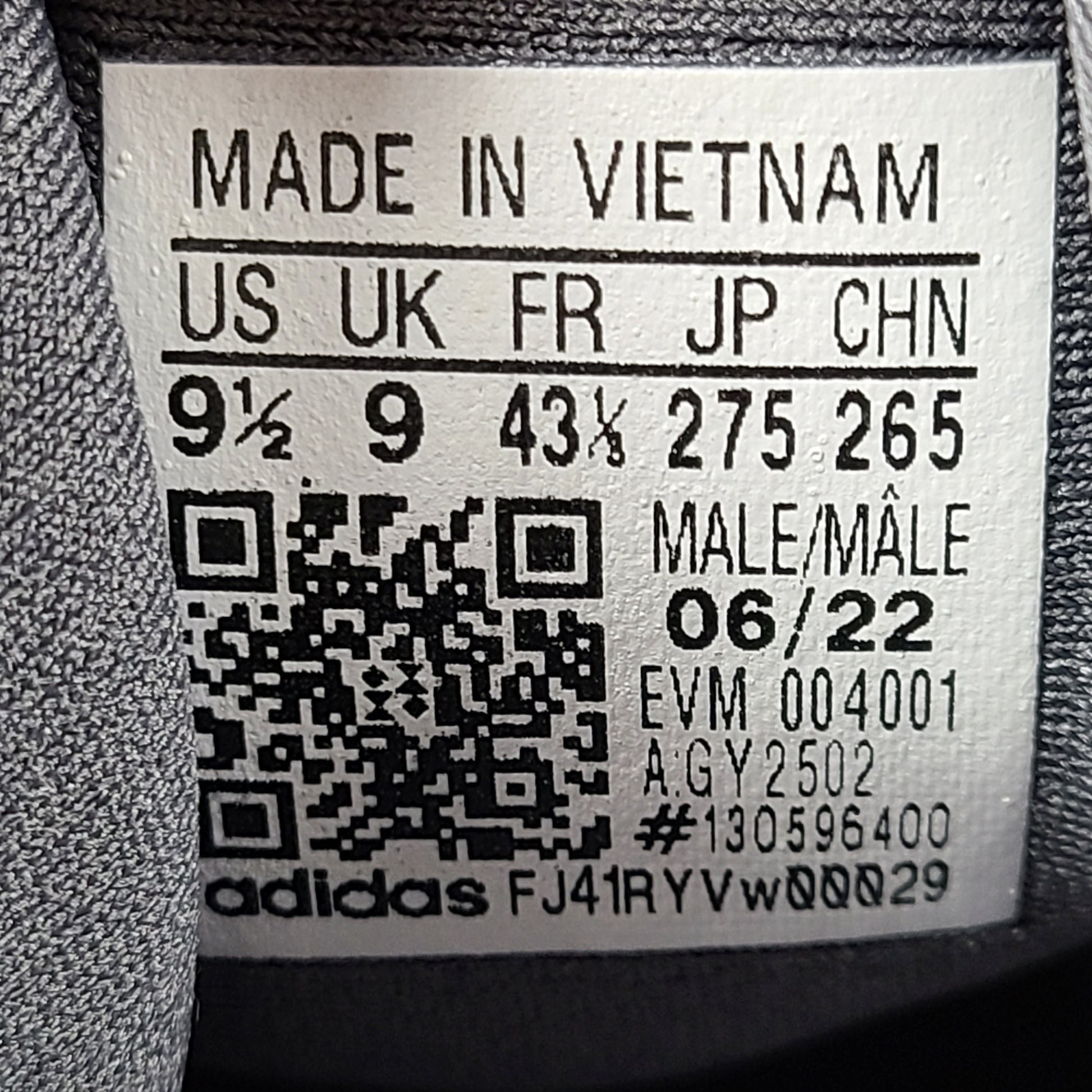 A pair of men's Adidas sneakers in size 9.5
