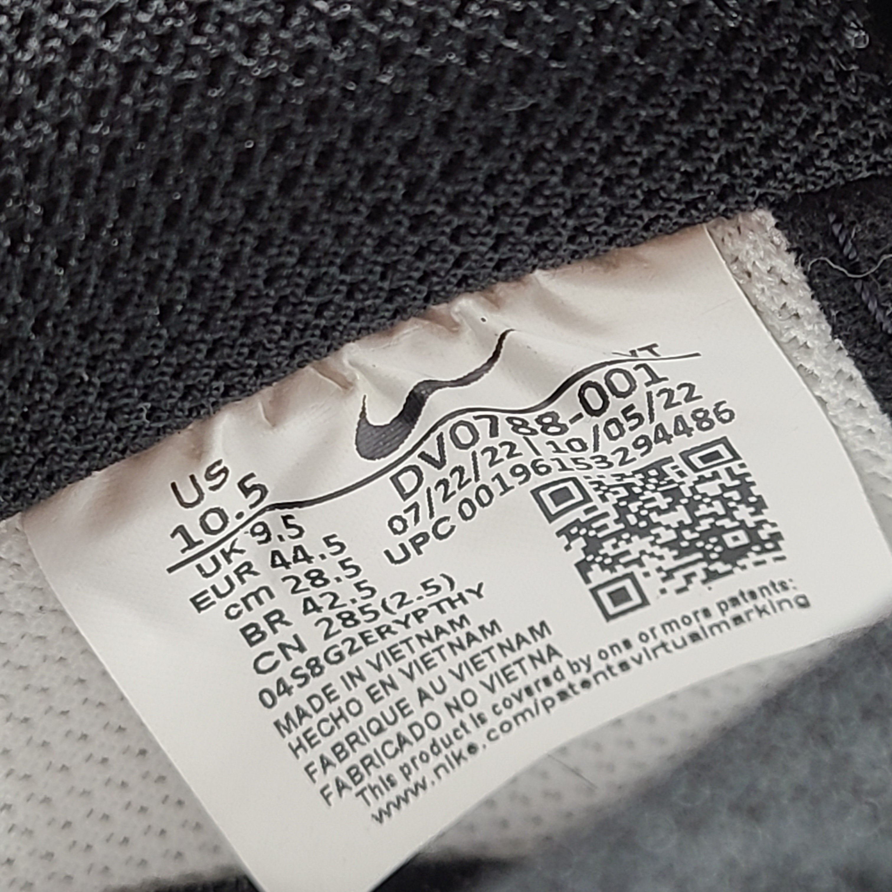 A stylish pair of Nike Air Force 1 Low sneakers in black and white.