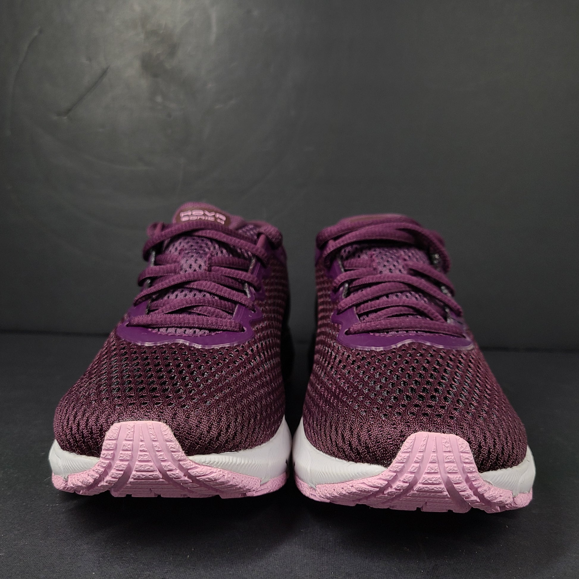A pair of purple Under Armour HOVR Sonic 4 running shoes for women size 5.