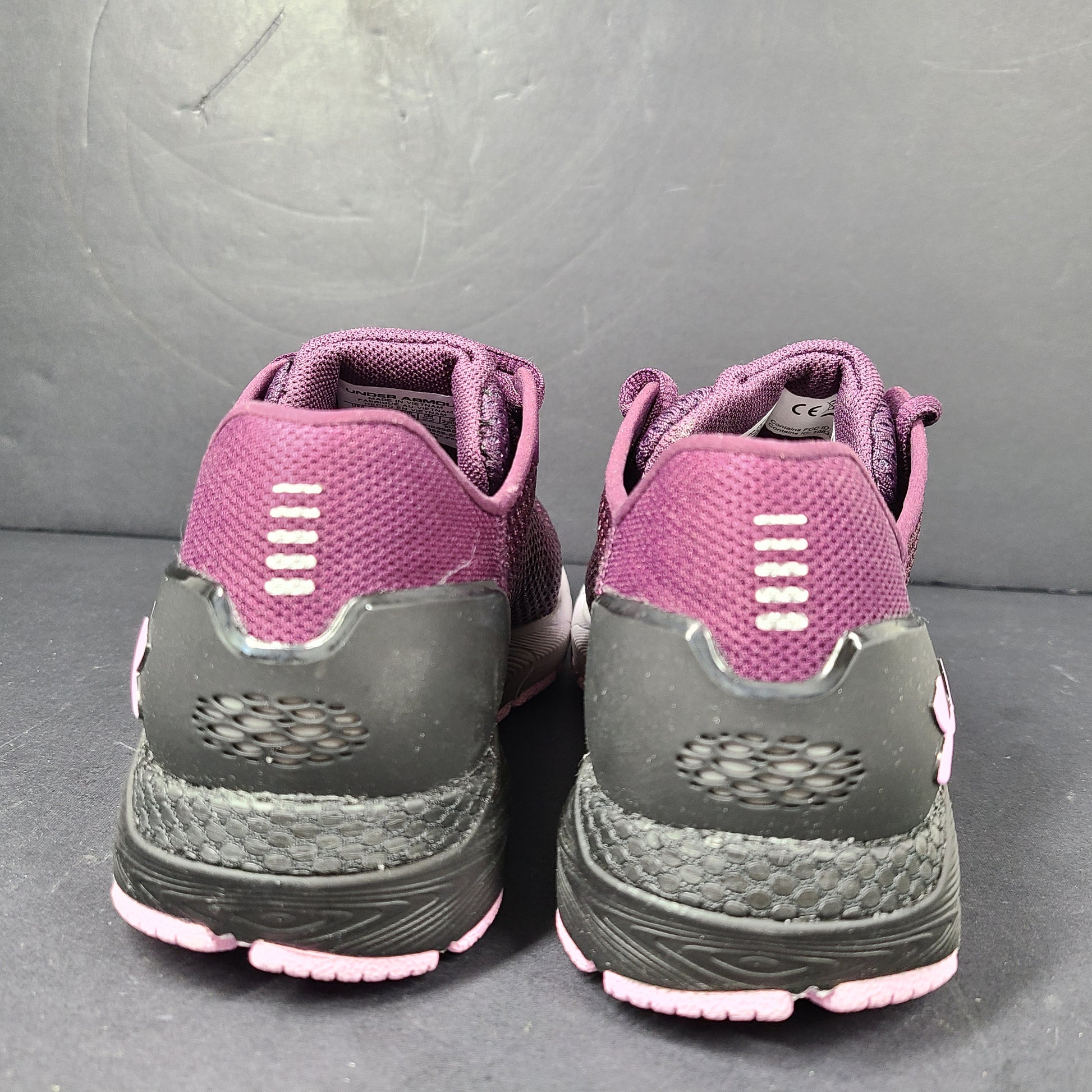A pair of purple Under Armour HOVR Sonic 4 running shoes for women size 5.