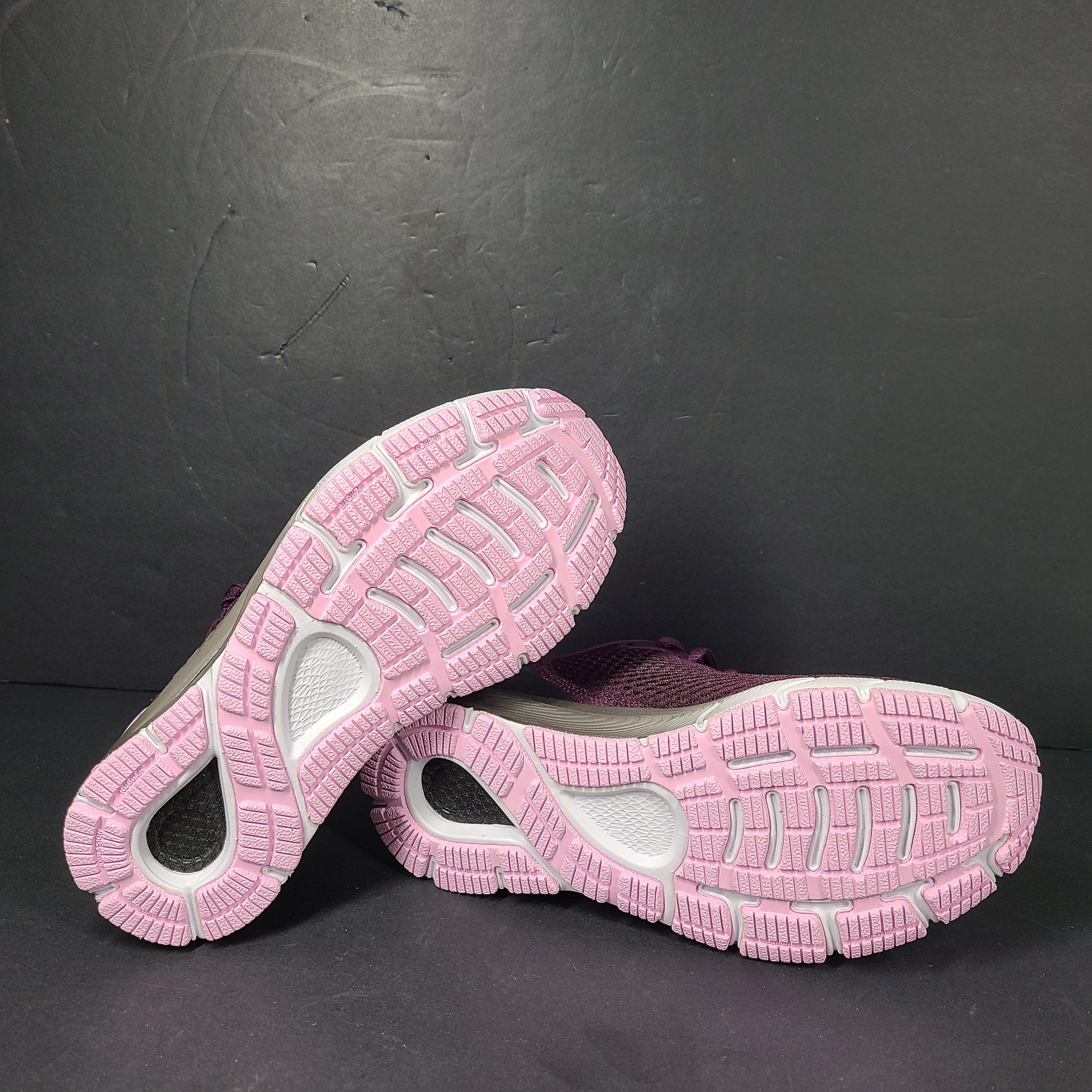 A pair of purple Under Armour HOVR Sonic 4 running shoes for women size 5.