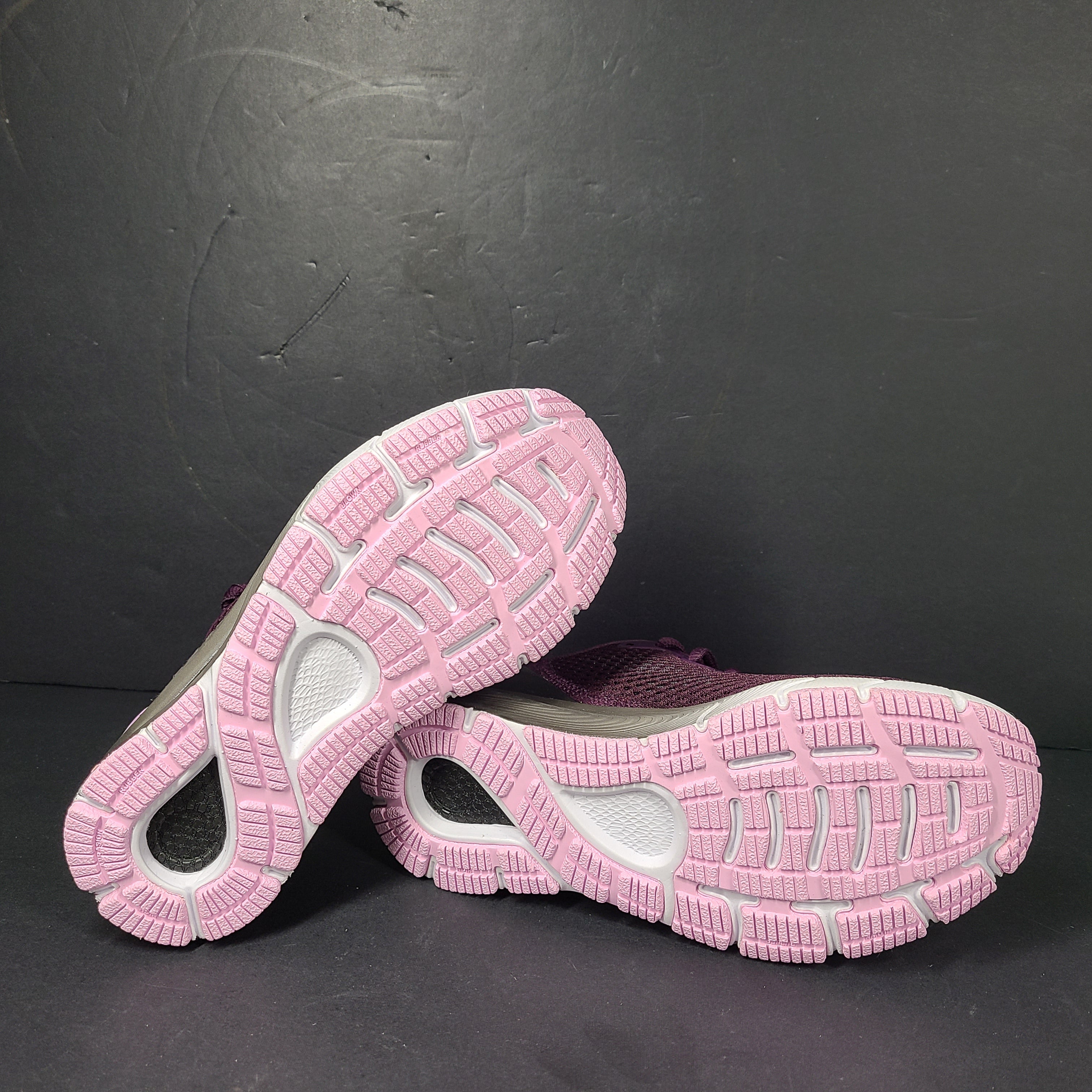 A pair of purple Under Armour HOVR Sonic 4 running shoes for women size 5.