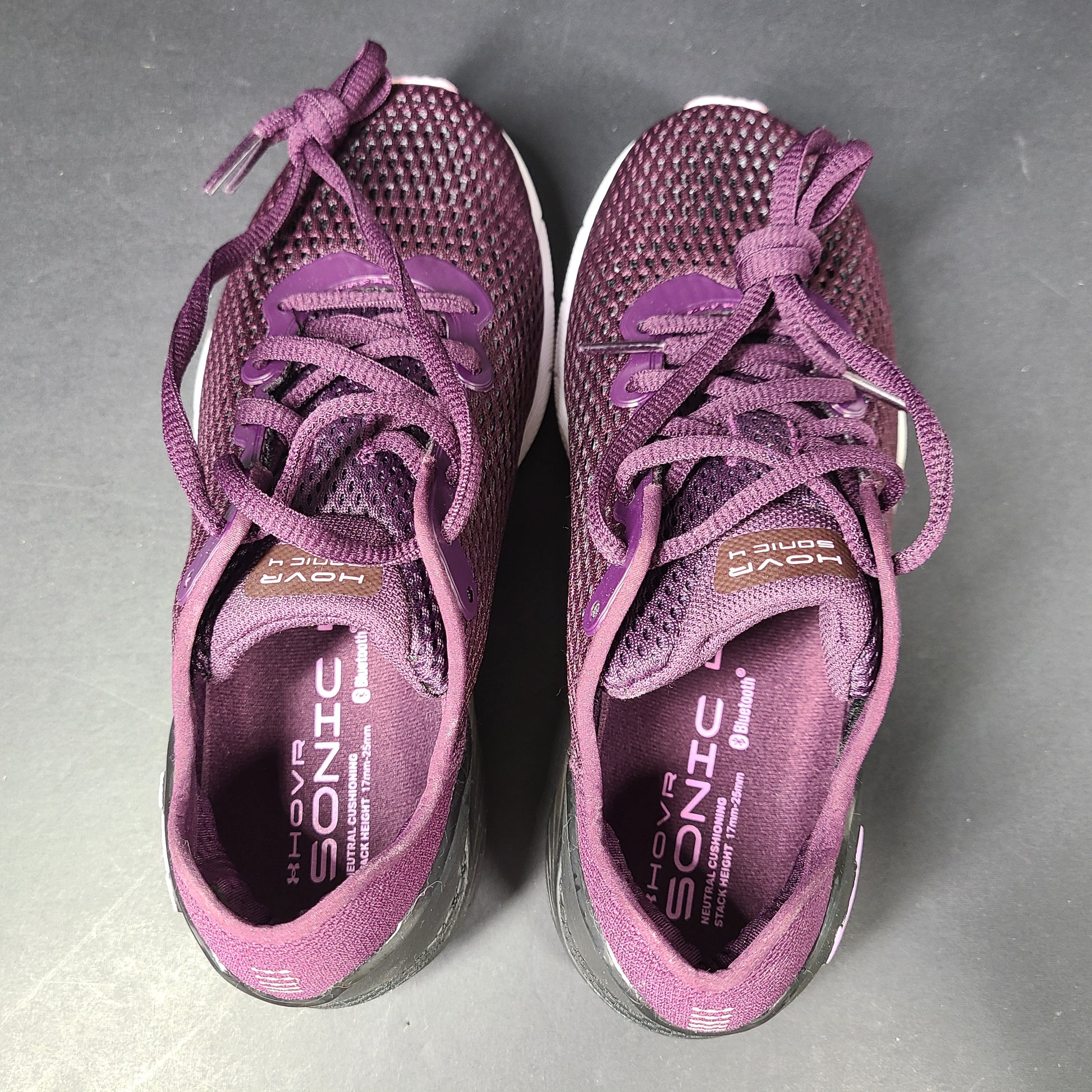 A pair of purple Under Armour HOVR Sonic 4 running shoes for women size 5.
