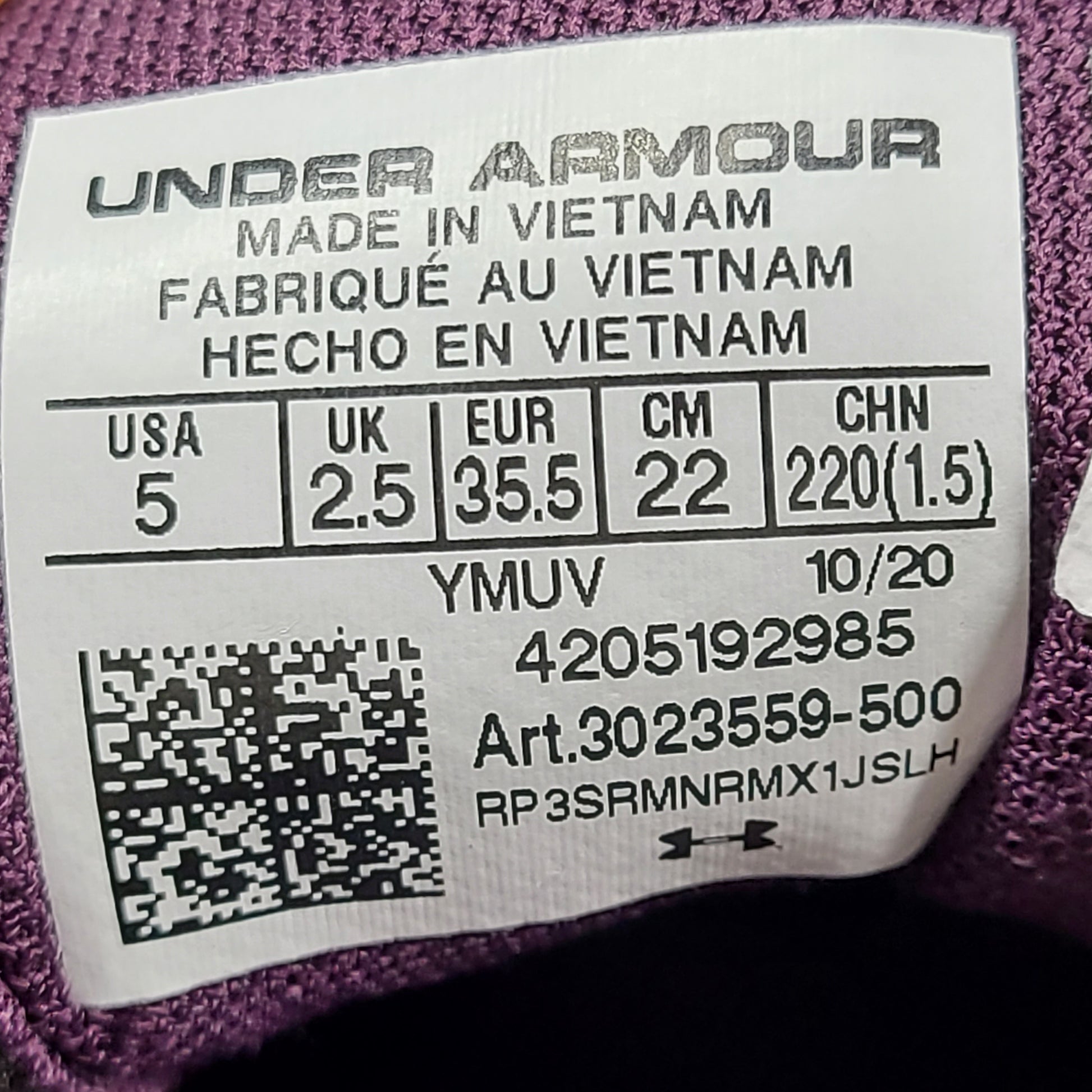 A pair of purple Under Armour HOVR Sonic 4 running shoes for women size 5.