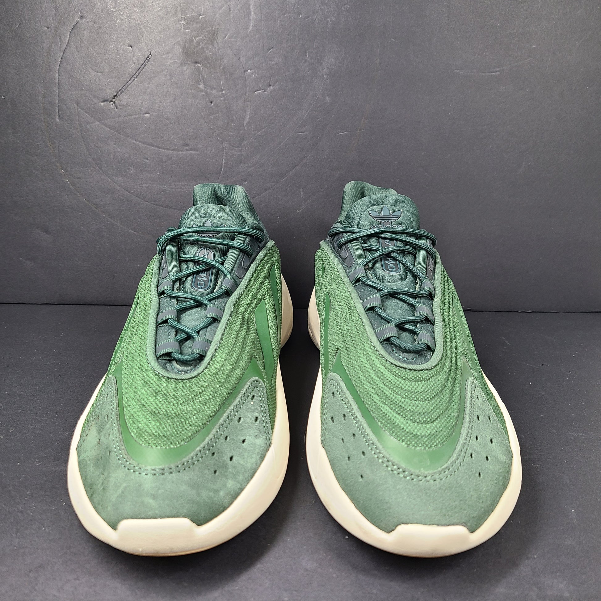 A pair of green Adidas Adiprene sneakers in size 9.5