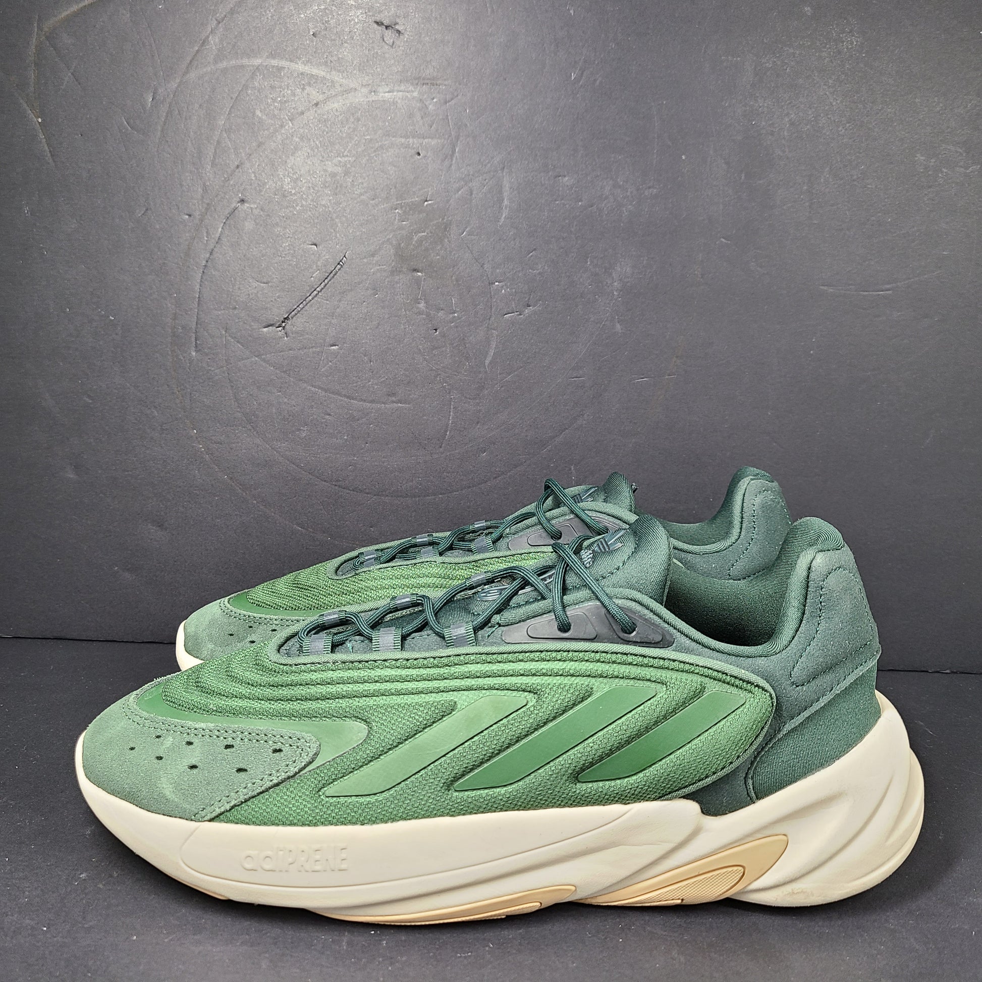 A pair of green Adidas Adiprene sneakers in size 9.5