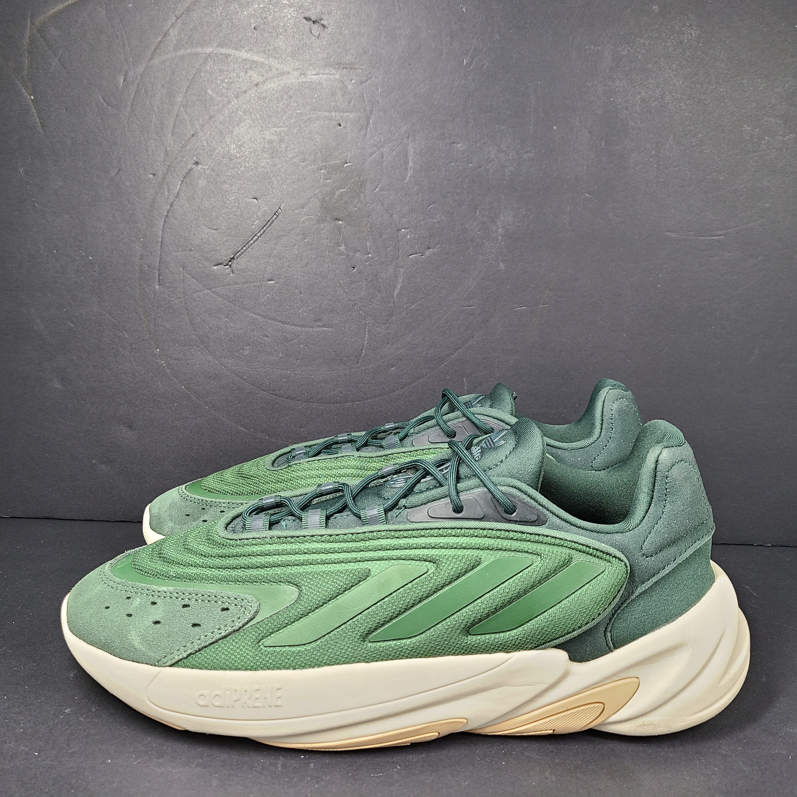 A pair of green Adidas Adiprene sneakers in size 9.5
