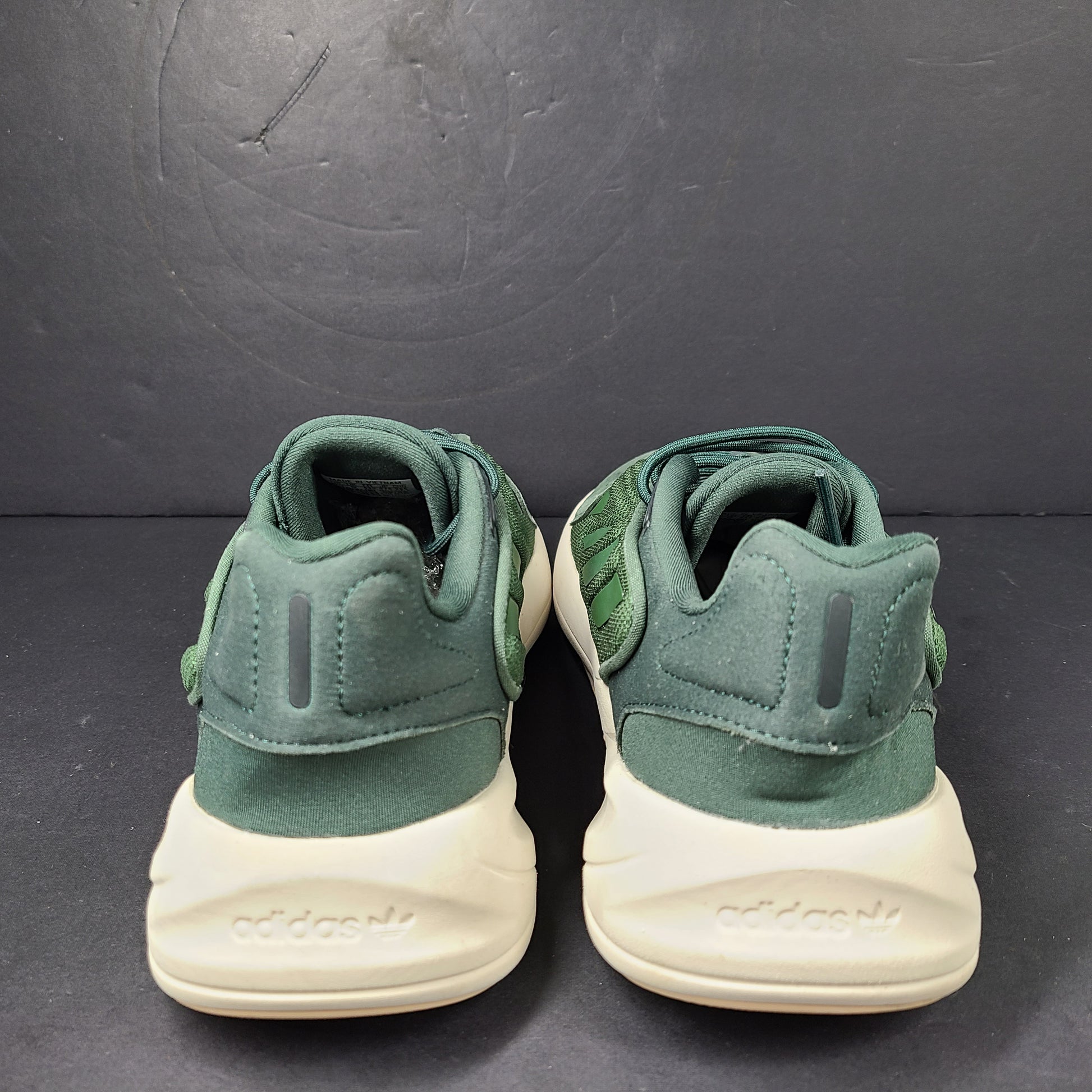 A pair of green Adidas Adiprene sneakers in size 9.5