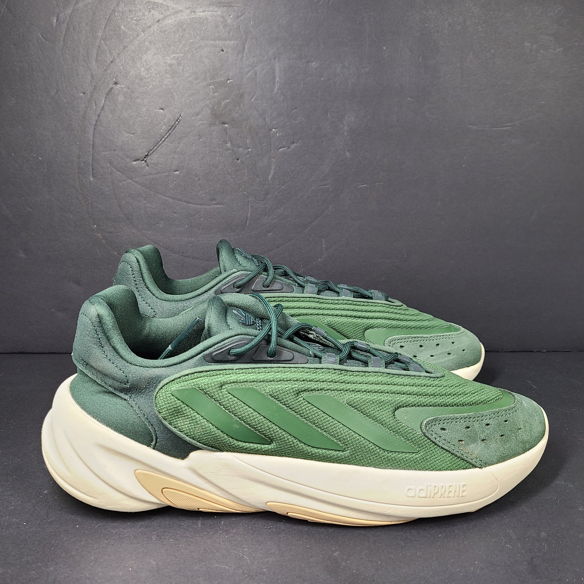 A pair of green Adidas Adiprene sneakers in size 9.5