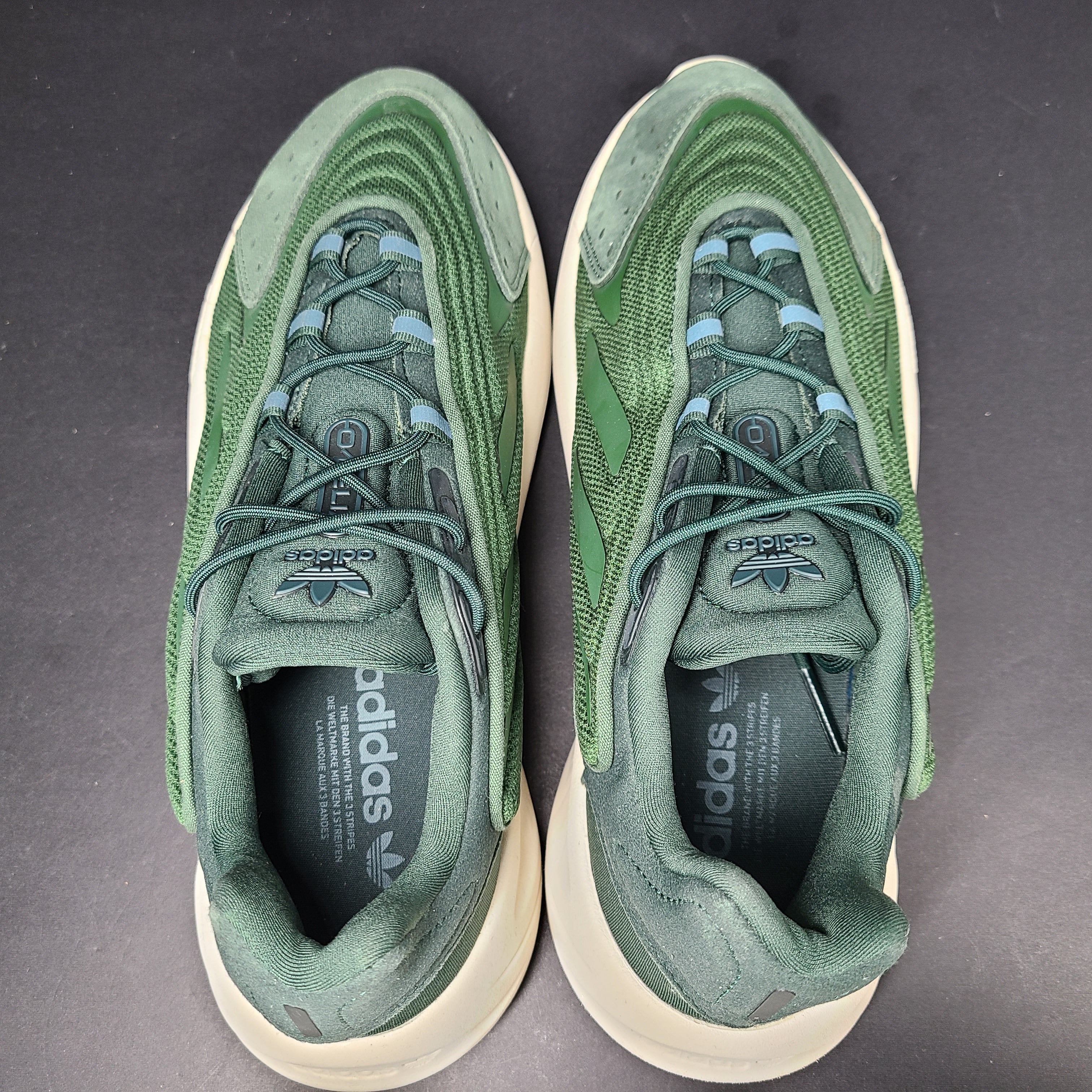 A pair of green Adidas Adiprene sneakers in size 9.5