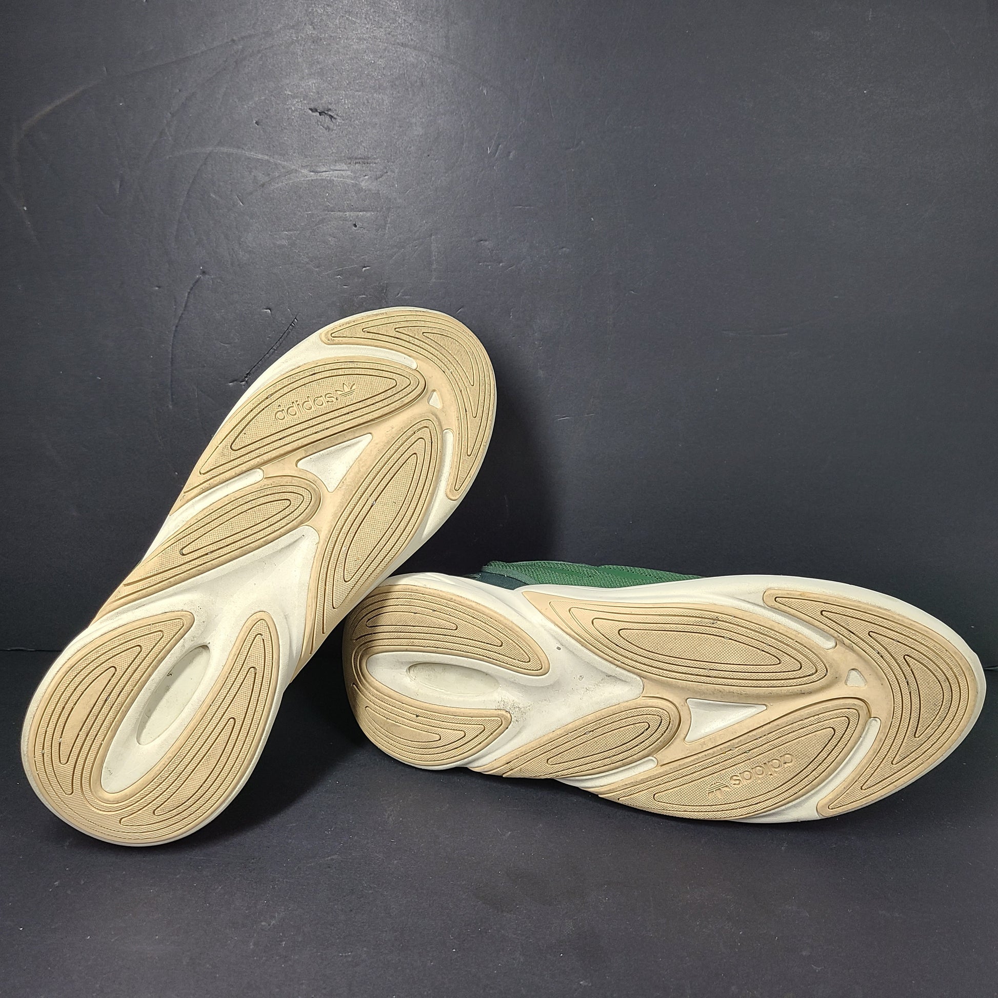 A pair of green Adidas Adiprene sneakers in size 9.5