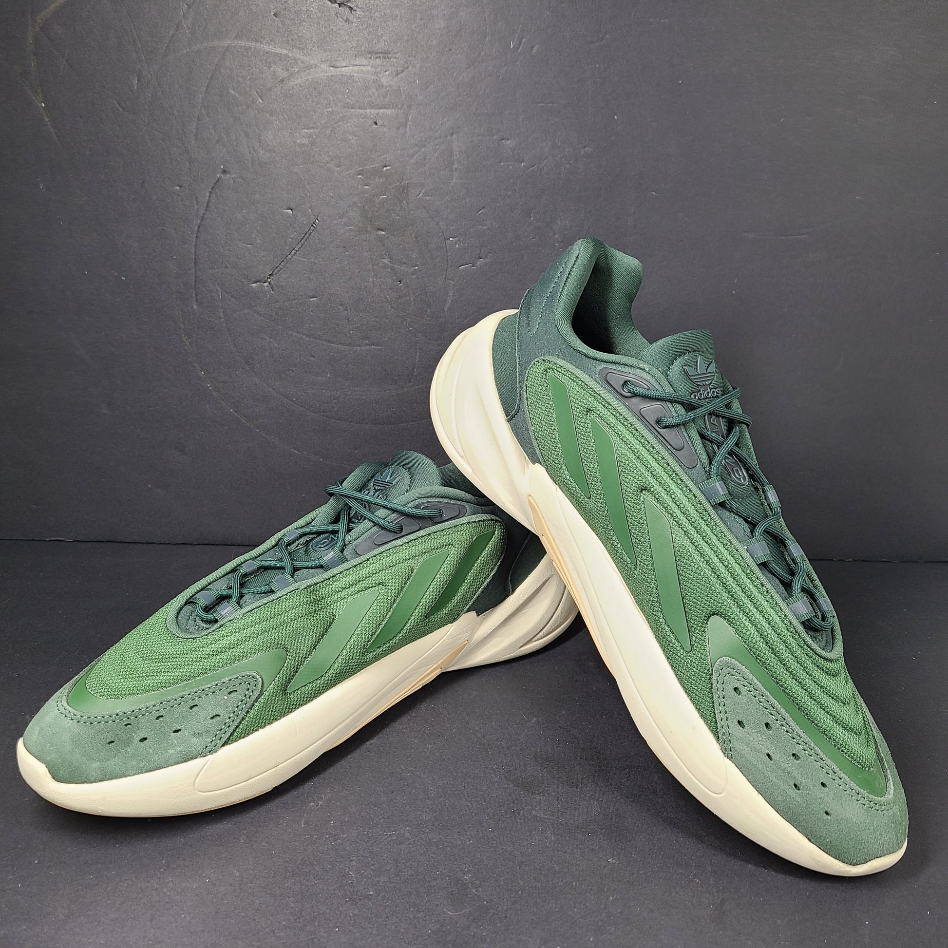 A pair of green Adidas Adiprene sneakers in size 9.5