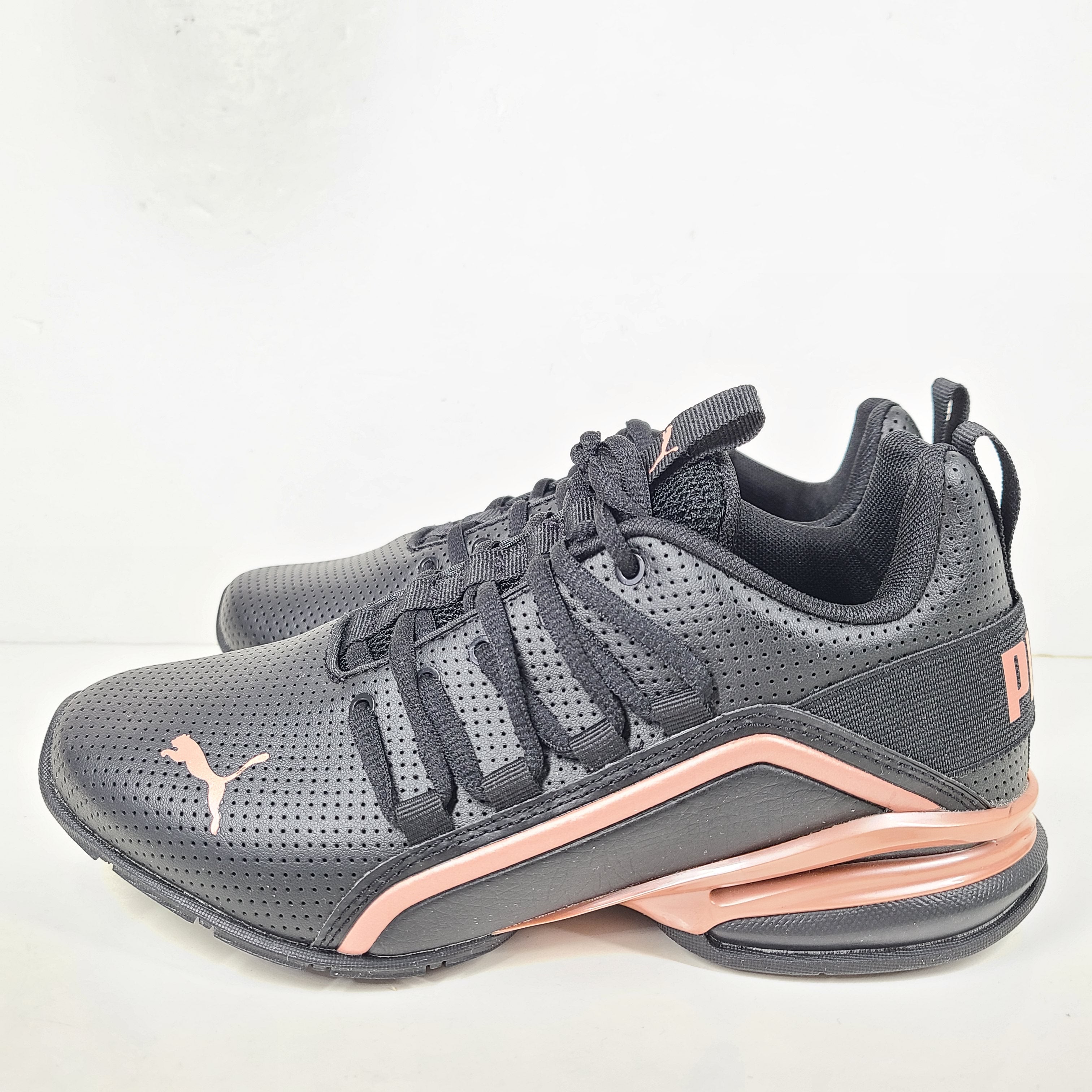 A pair of black and pink Puma Women's Training Shoes
