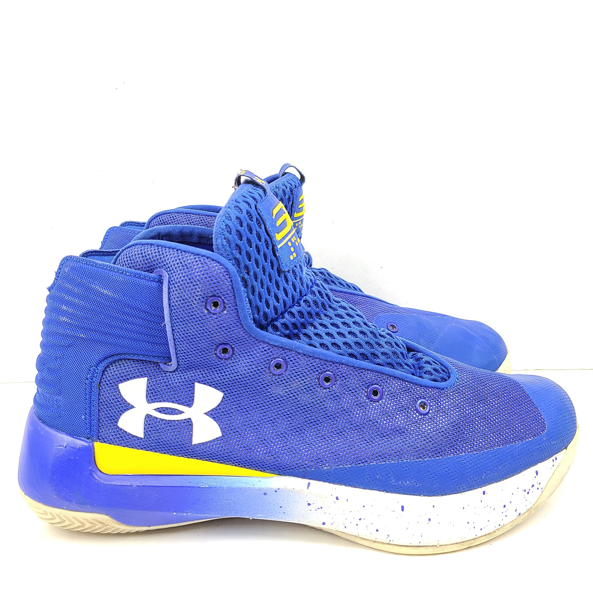 A pair of blue and yellow Under Armour basketball sneakers