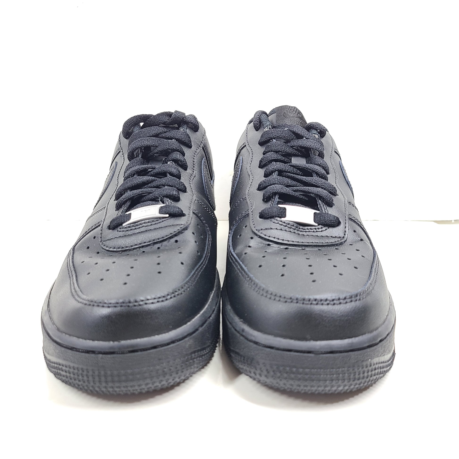 A pair of black Nike Air Force 1 Low sneakers for men