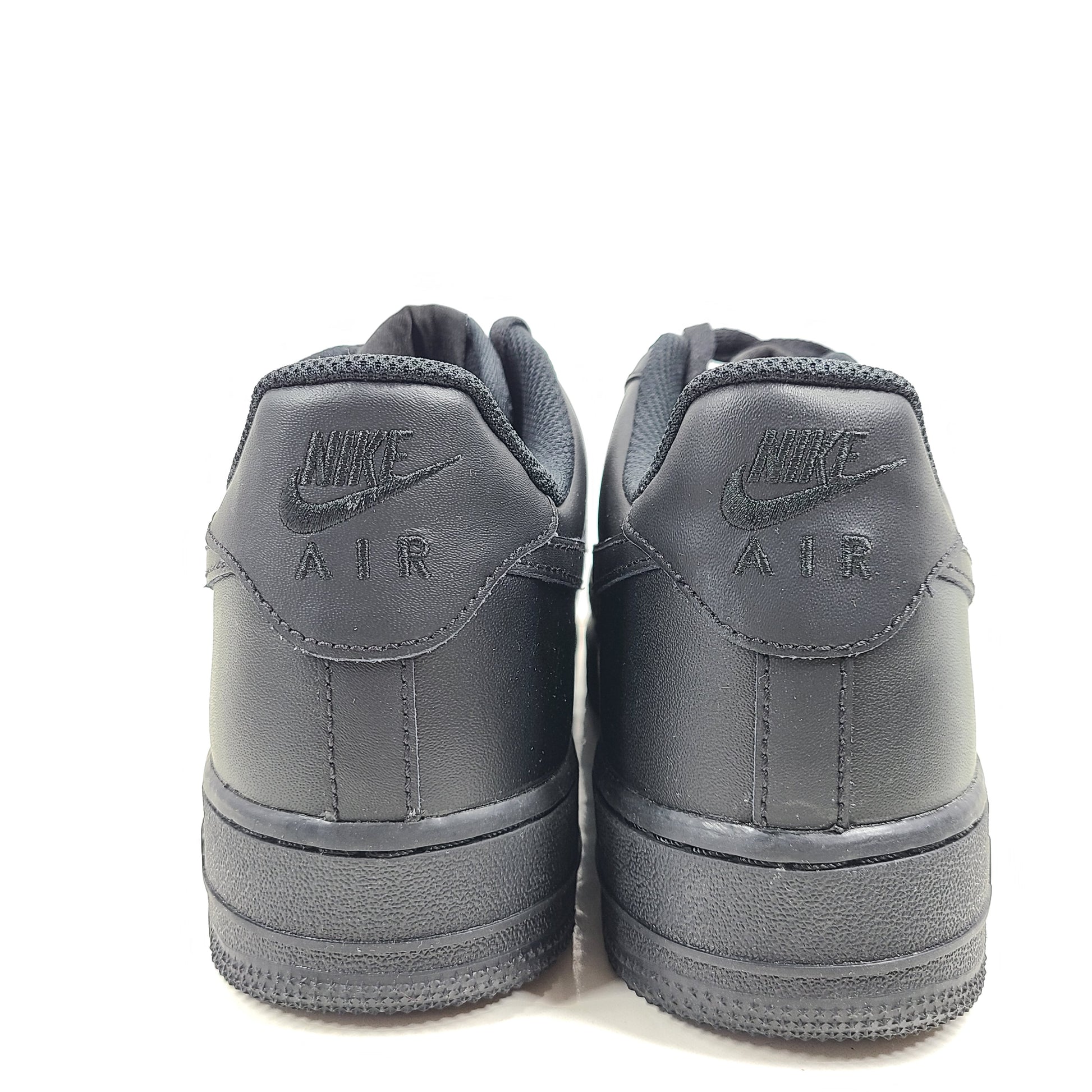 A pair of black Nike Air Force 1 Low sneakers for men