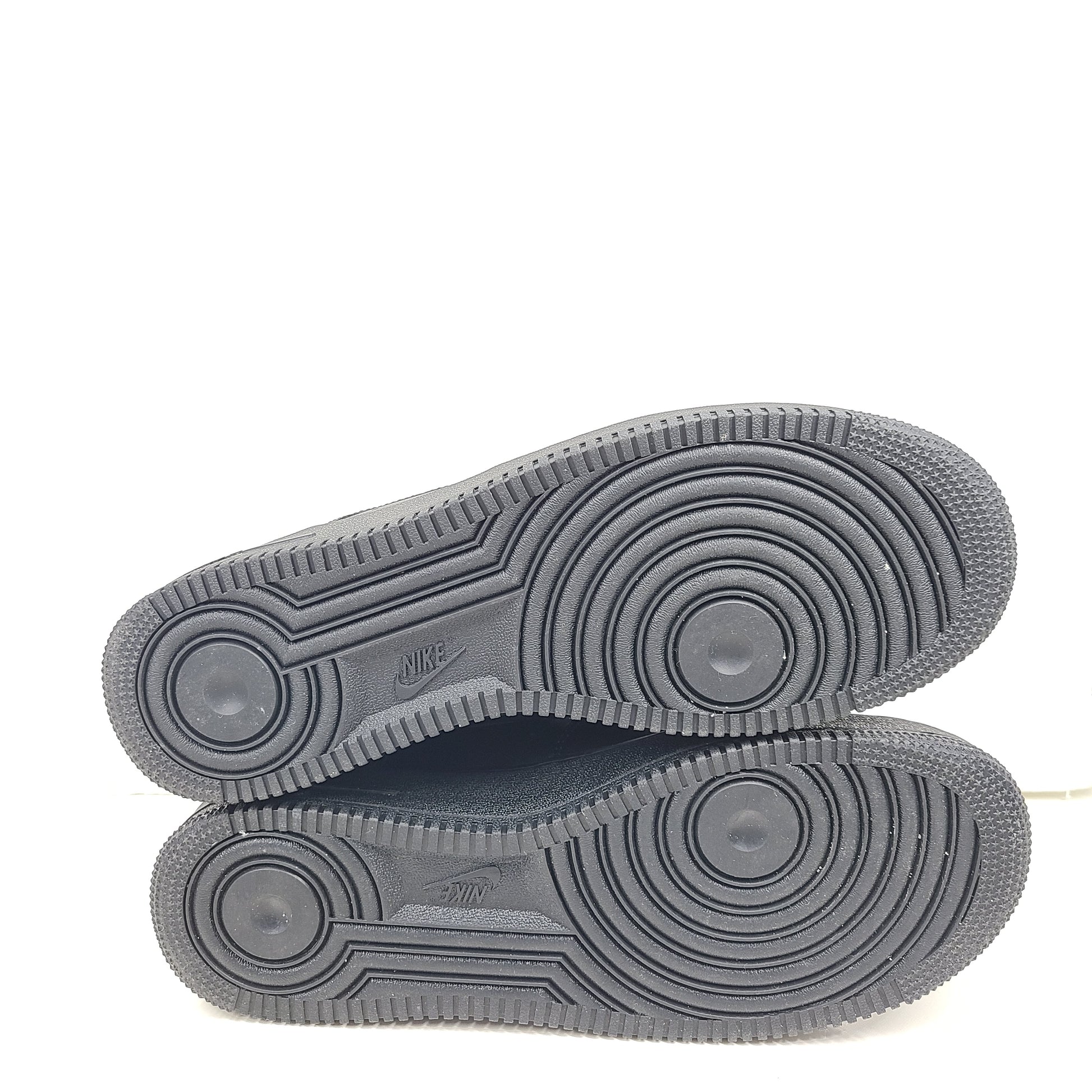 A pair of black Nike Air Force 1 Low sneakers for men