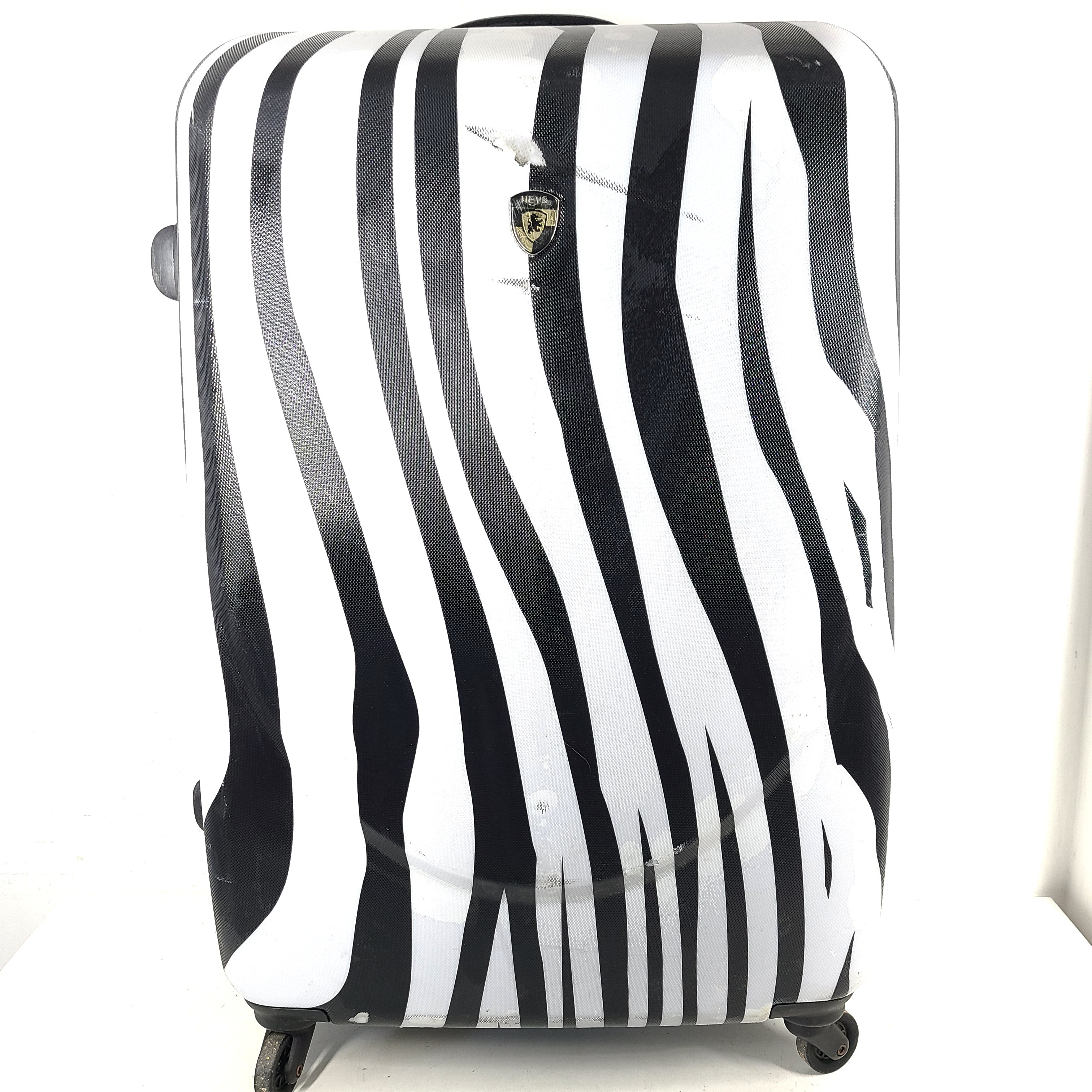 A stylish zebra-print hard shell luggage by Heys