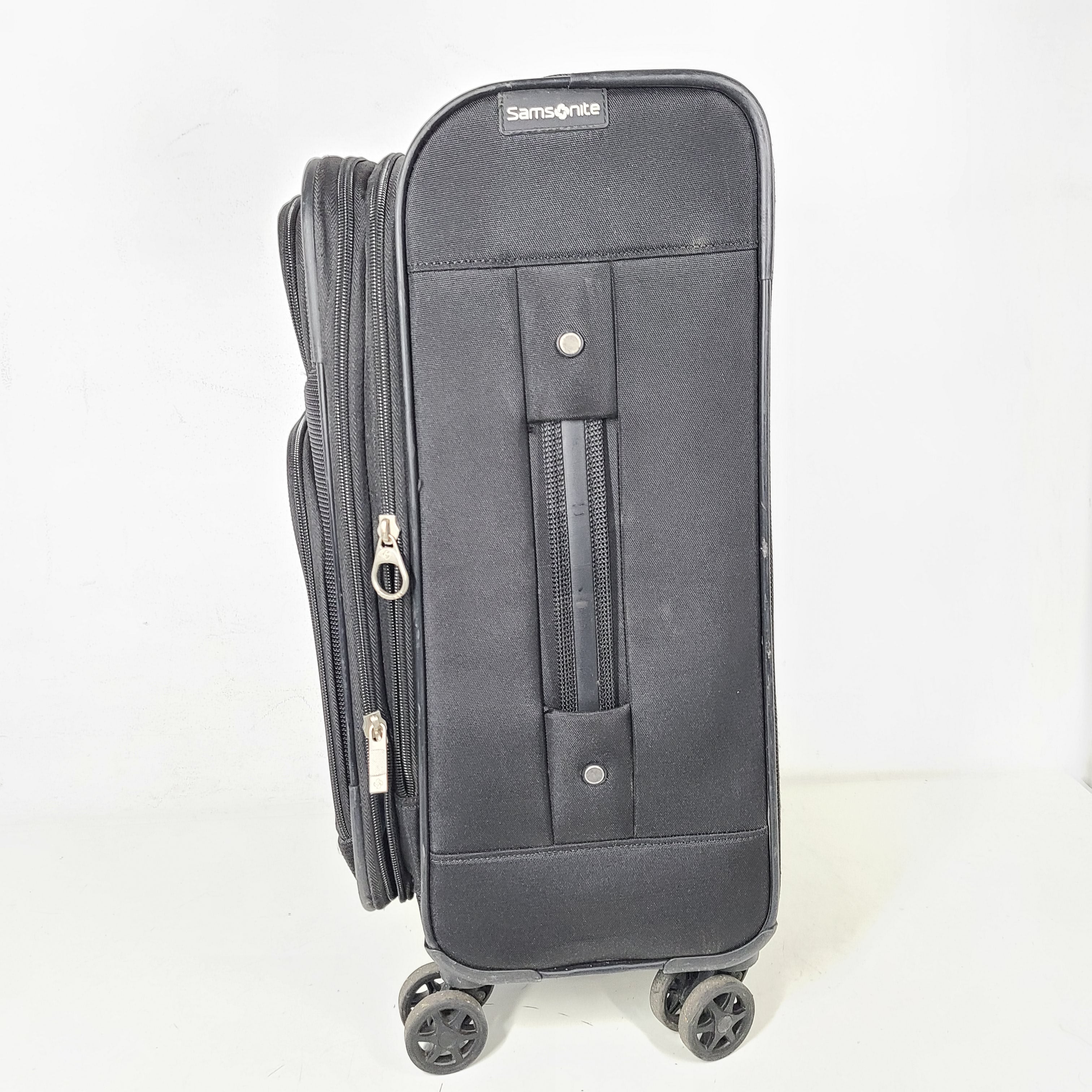 A black Samsonite spinner suitcase with model number NA01019309.