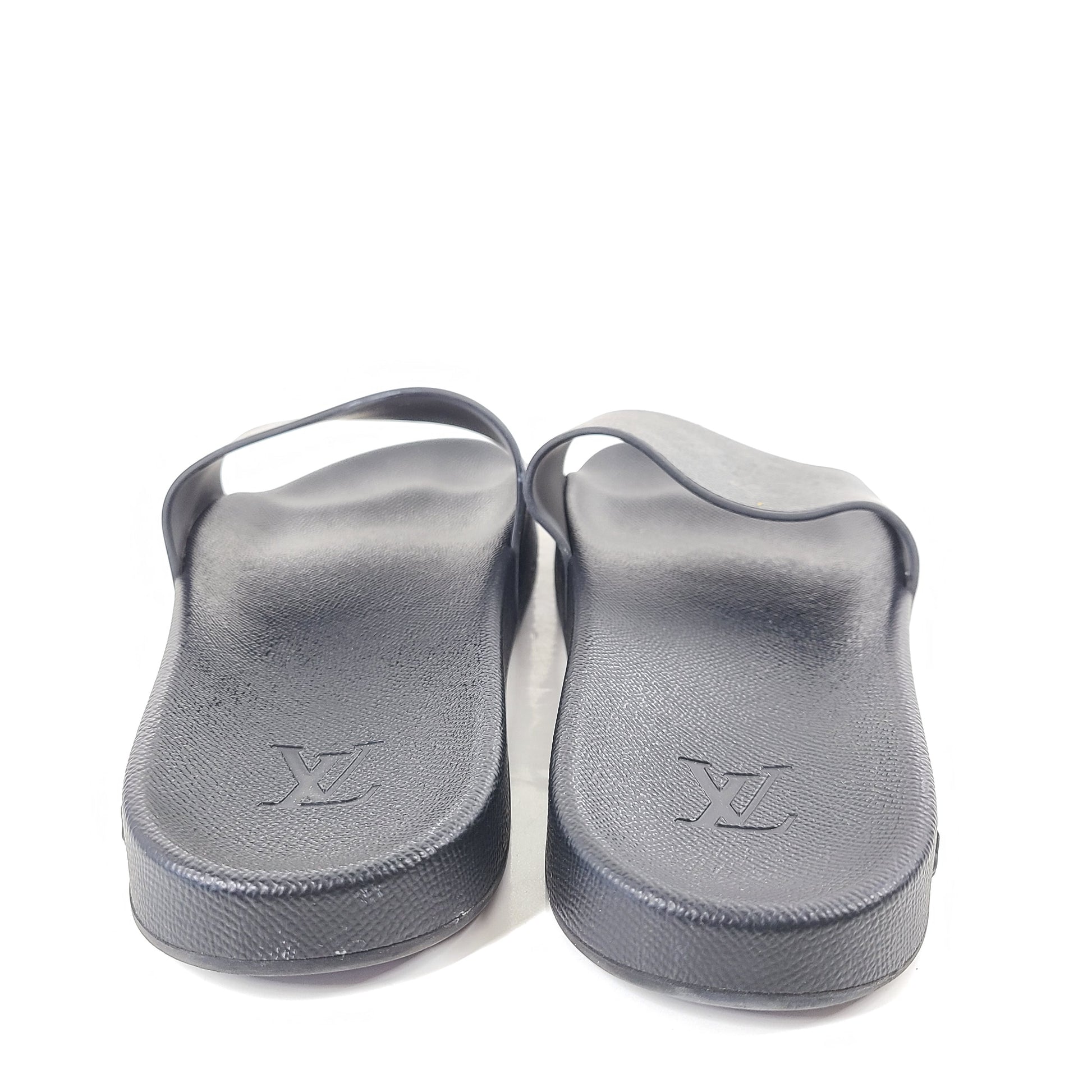 A pair of men's Louis Vuitton Monogram Slippers in size 9