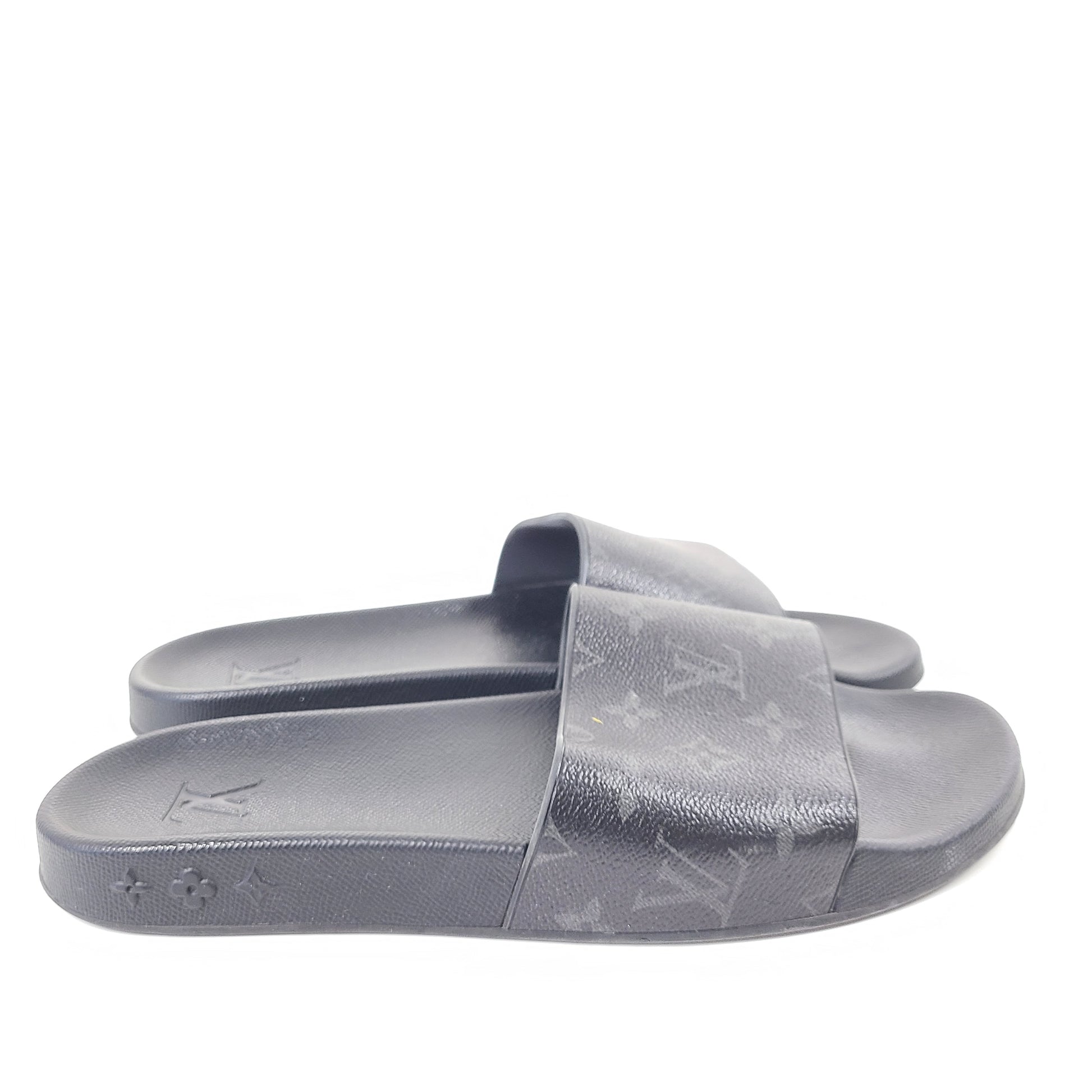 A pair of men's Louis Vuitton Monogram Slippers in size 9