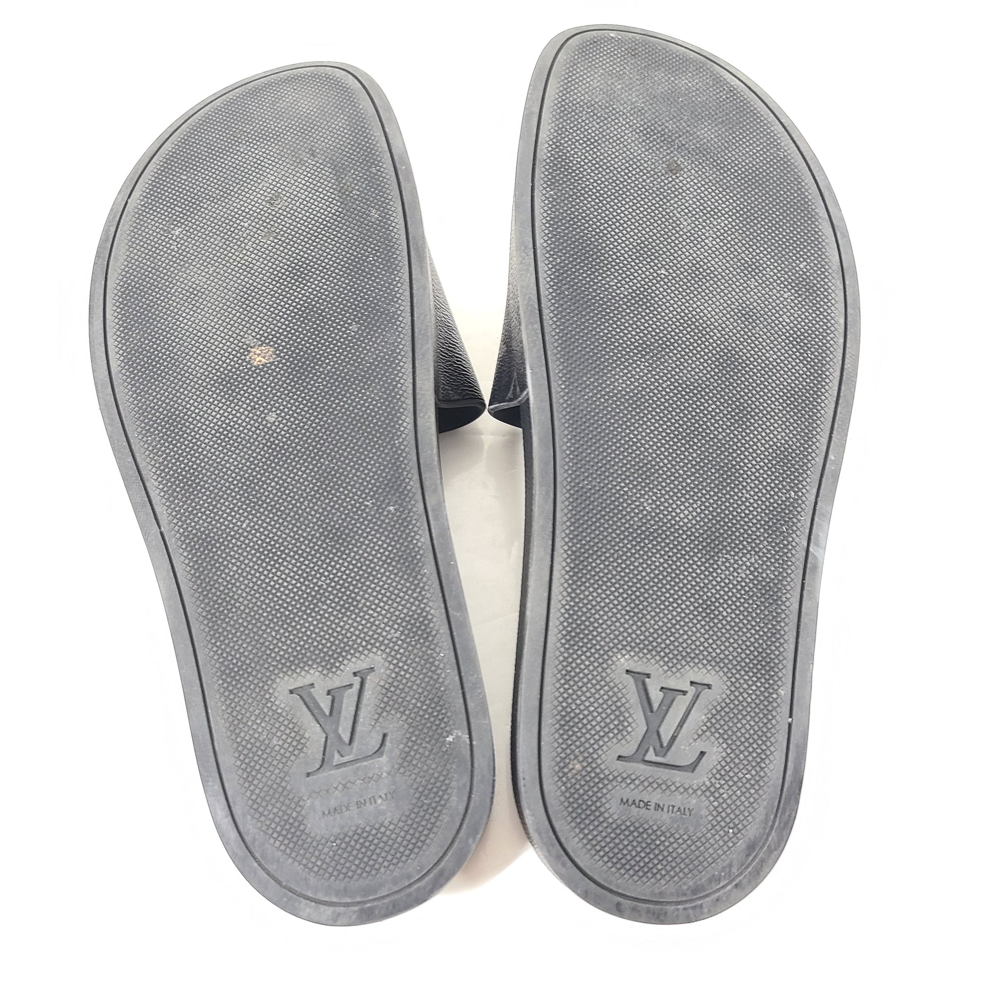 A pair of men's Louis Vuitton Monogram Slippers in size 9