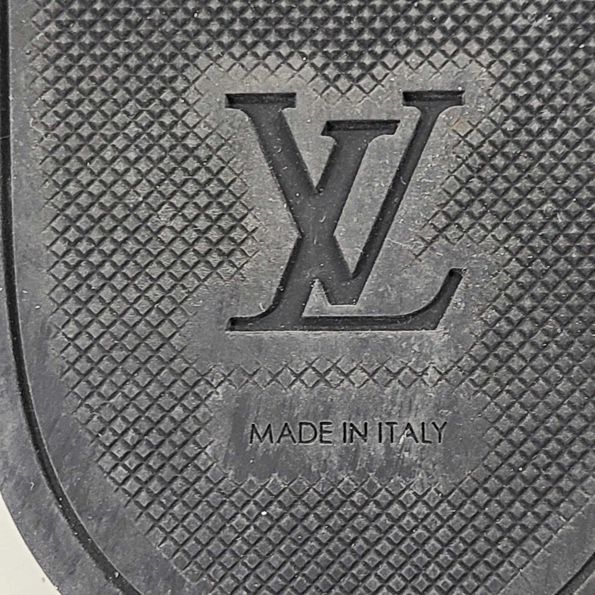 A pair of men's Louis Vuitton Monogram Slippers in size 9
