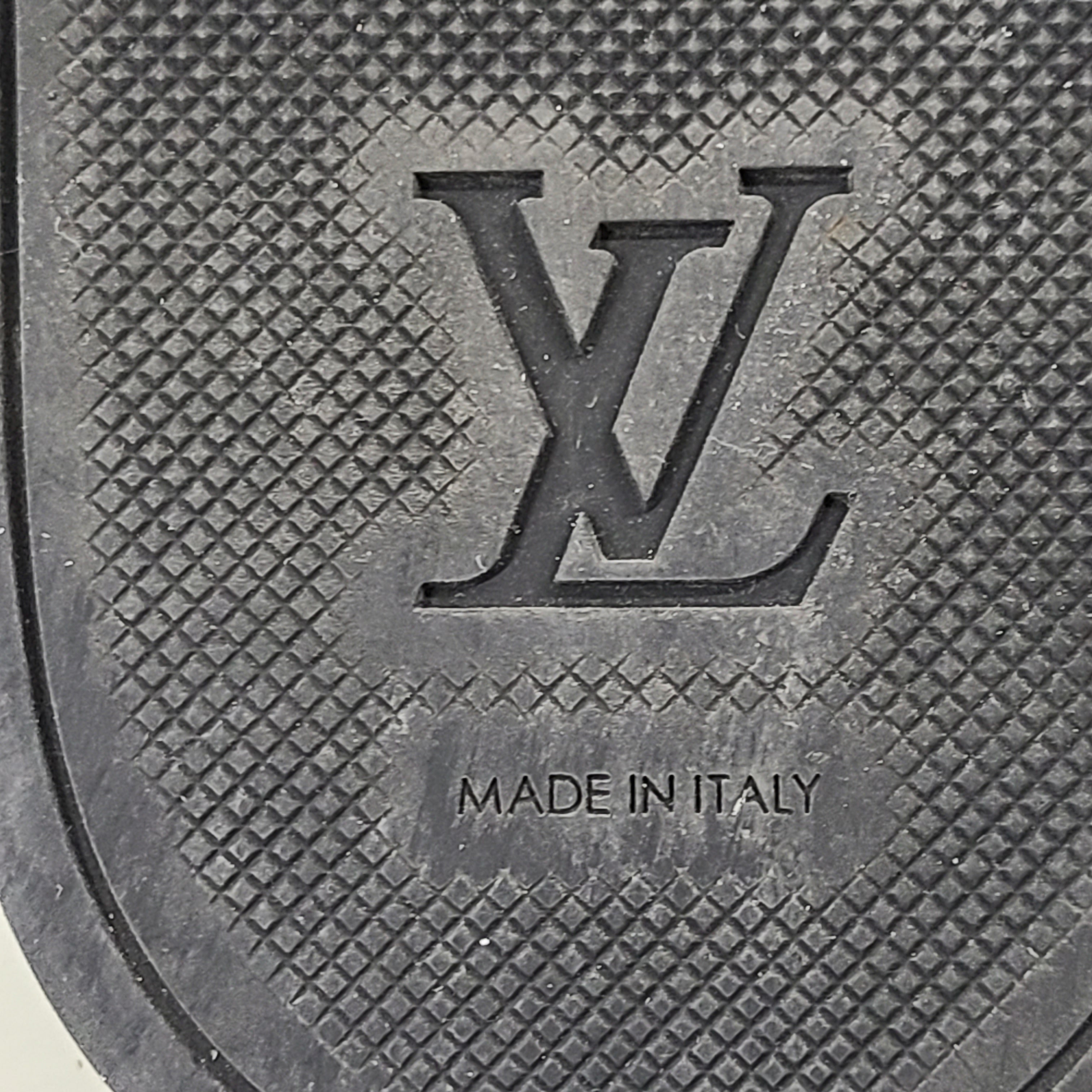 A pair of men's Louis Vuitton Monogram Slippers in size 9