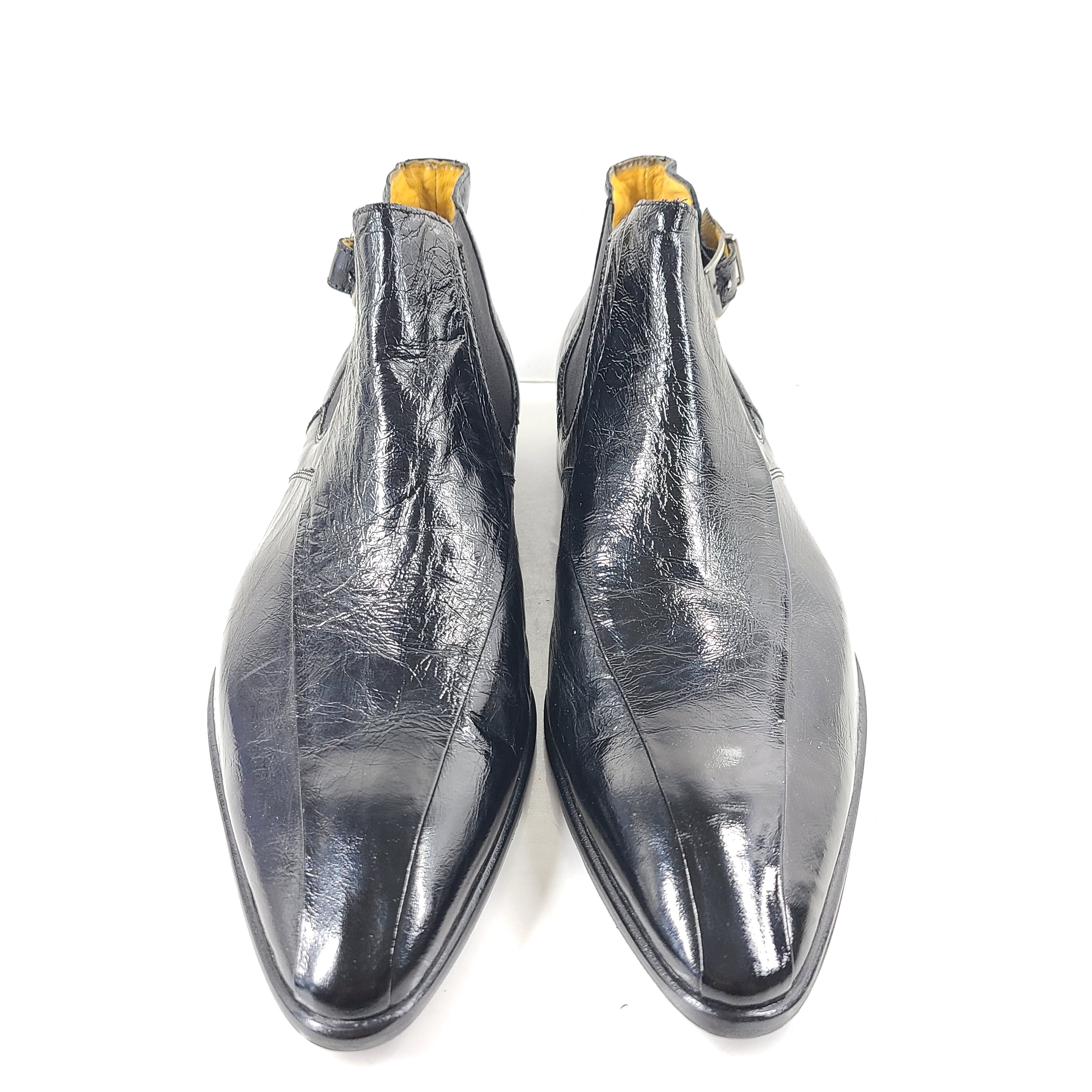 A pair of black leather Chelsea boots for men, size 44.