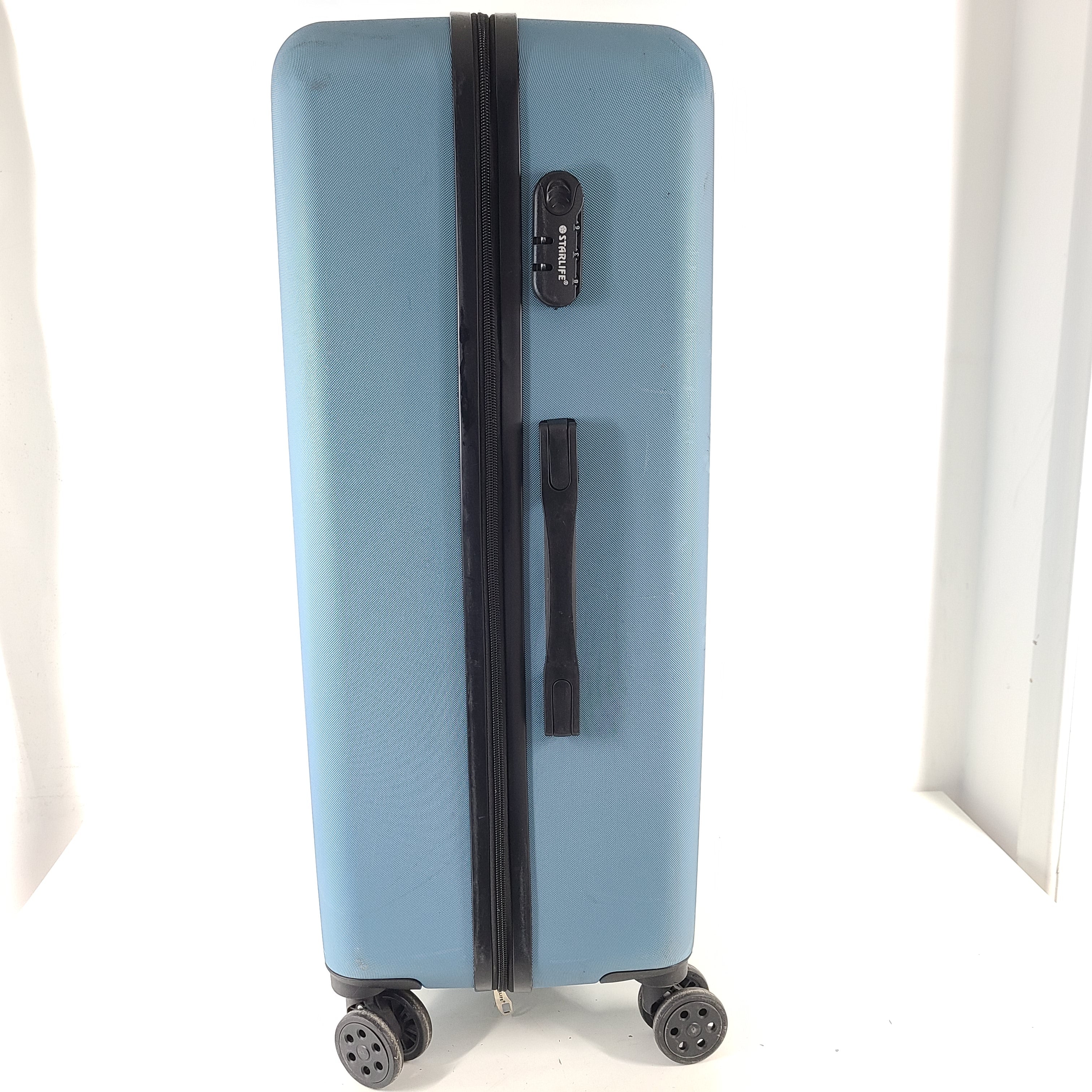 A versatile blue hard-shell suitcase with spinner wheels.
