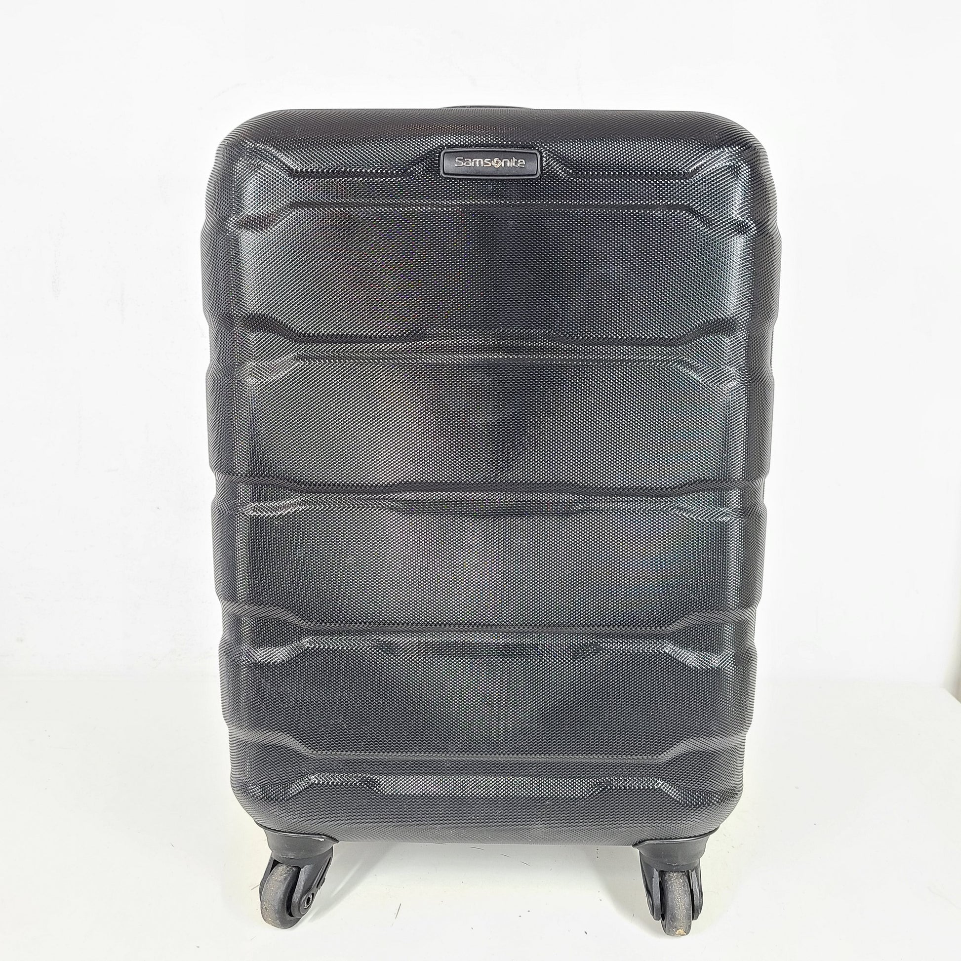A black Samsonite spinner luggage.
