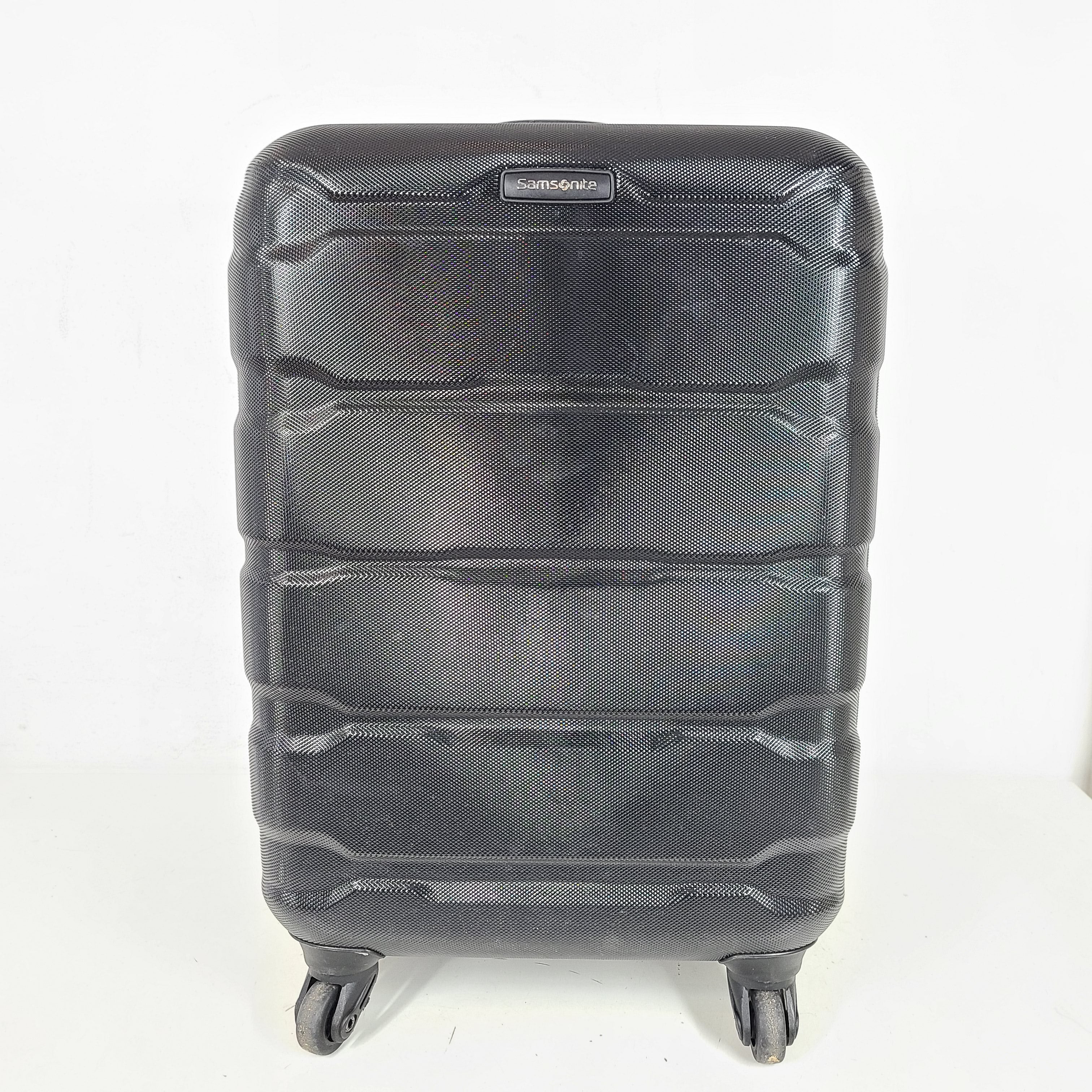 A black Samsonite spinner luggage.