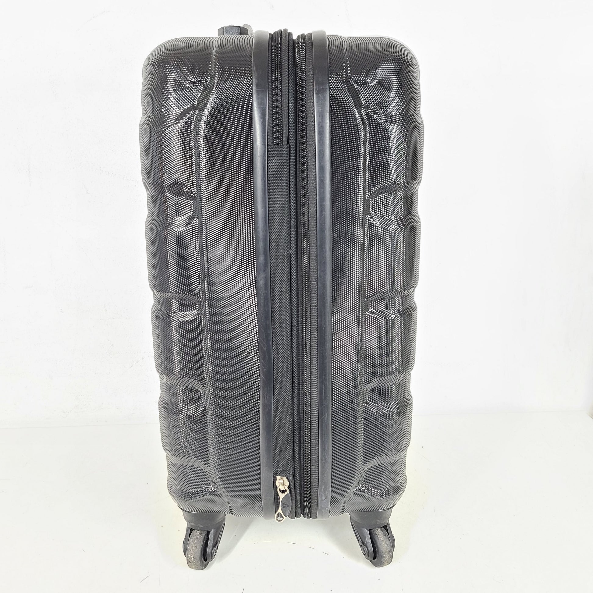 A black Samsonite spinner luggage.